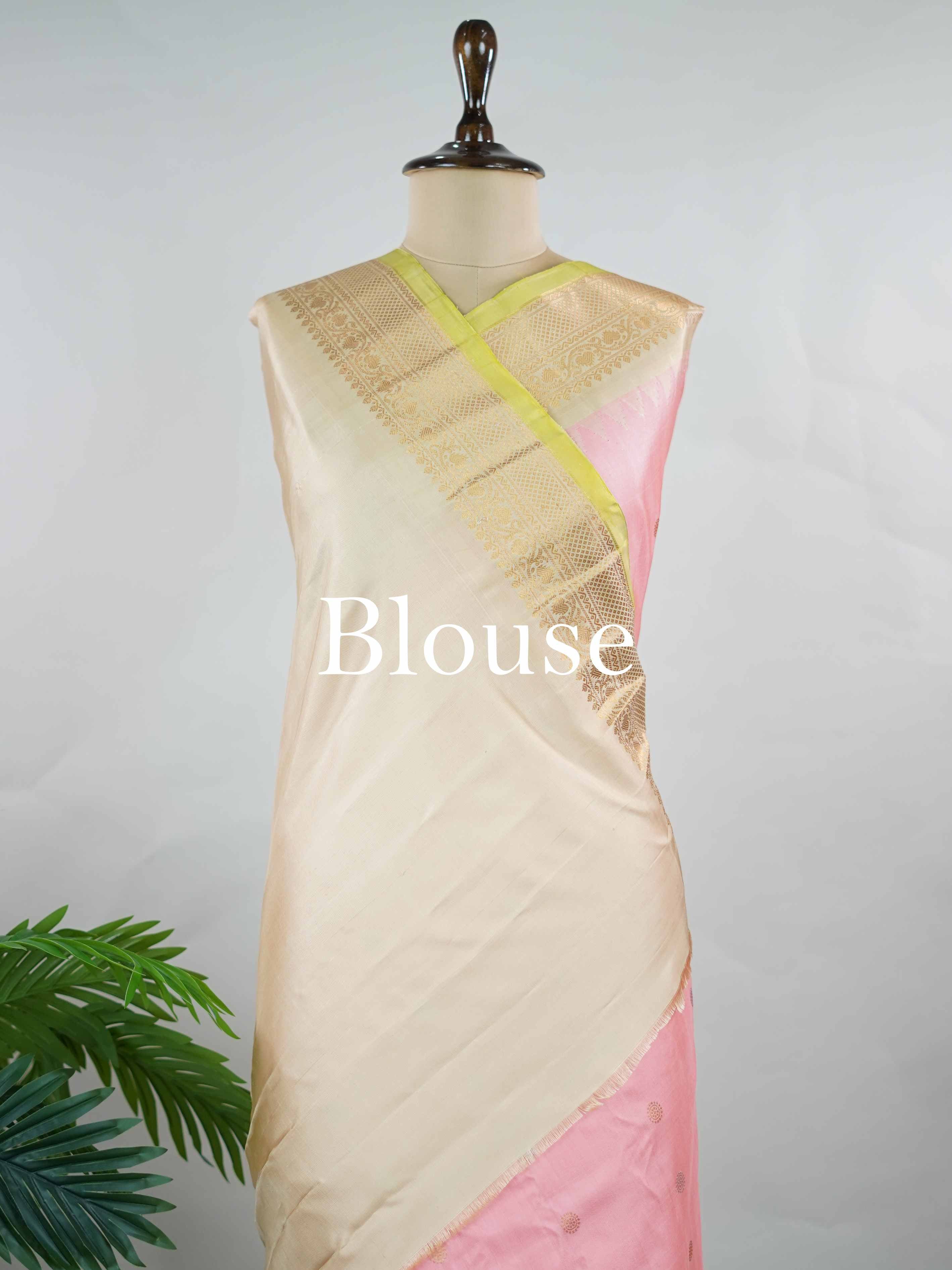 Gadwal Silk Embrace soft elegance with this Gadwal saree in a delicate baby pink shade, paired with a graceful beige blouse. /spanspanThe design is enriched with elegant gold and silver buttas that add a subtle festive glow. /spanspanIts traditional weave offers a refined drape that beautifully blends charm and sophistication. /spanspanPerfect for festive occasions, celebrations, and special gatherings that call for timeless grace. Shashwati - Handloom Gadwal Silk Saree | Pure Silk | Zari Border - Manoranji