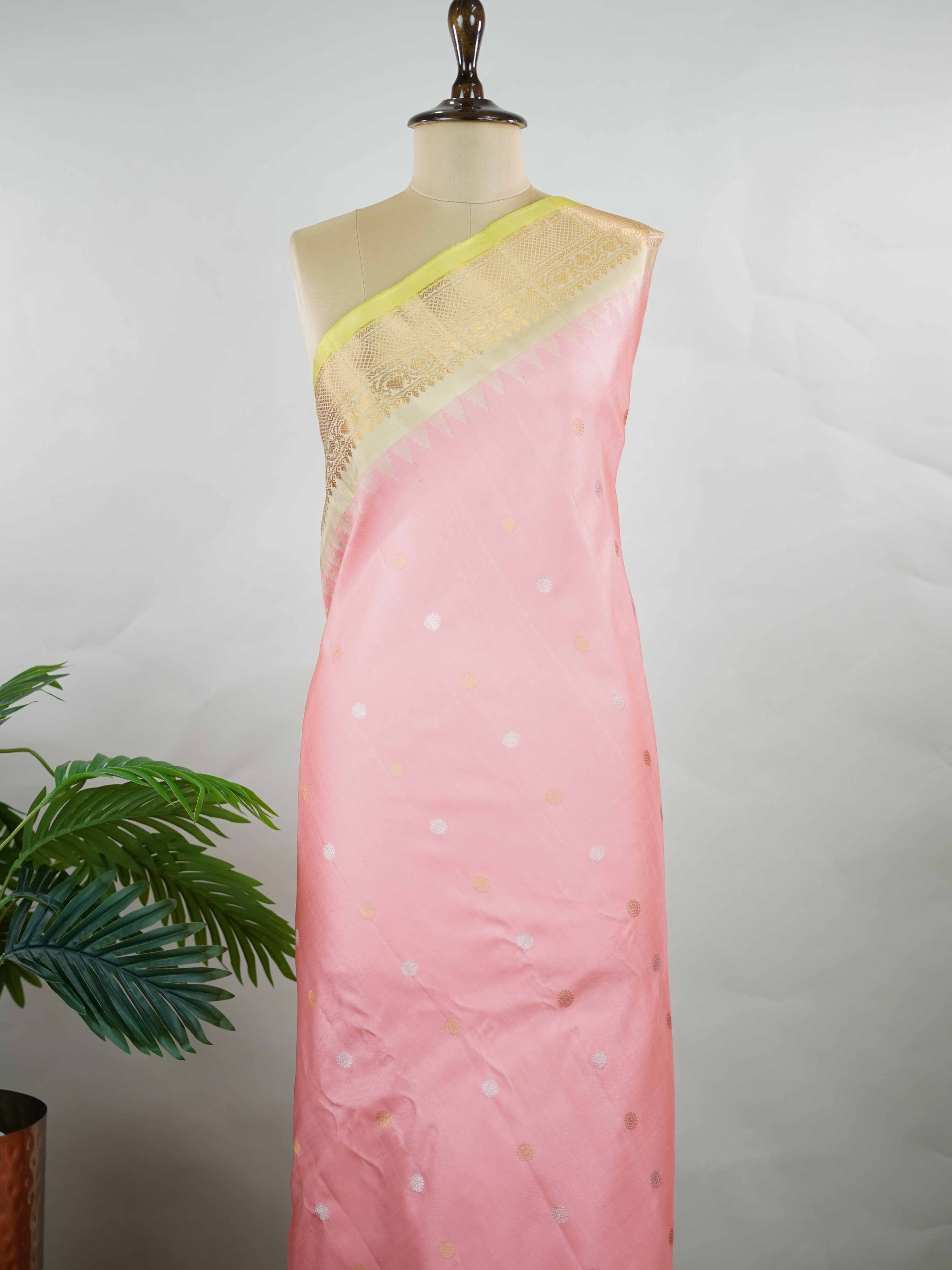 Gadwal Silk Embrace soft elegance with this Gadwal saree in a delicate baby pink shade, paired with a graceful beige blouse. /spanspanThe design is enriched with elegant gold and silver buttas that add a subtle festive glow. /spanspanIts traditional weave offers a refined drape that beautifully blends charm and sophistication. /spanspanPerfect for festive occasions, celebrations, and special gatherings that call for timeless grace. Shashwati - Handloom Gadwal Silk Saree | Pure Silk | Zari Border - Manoranji