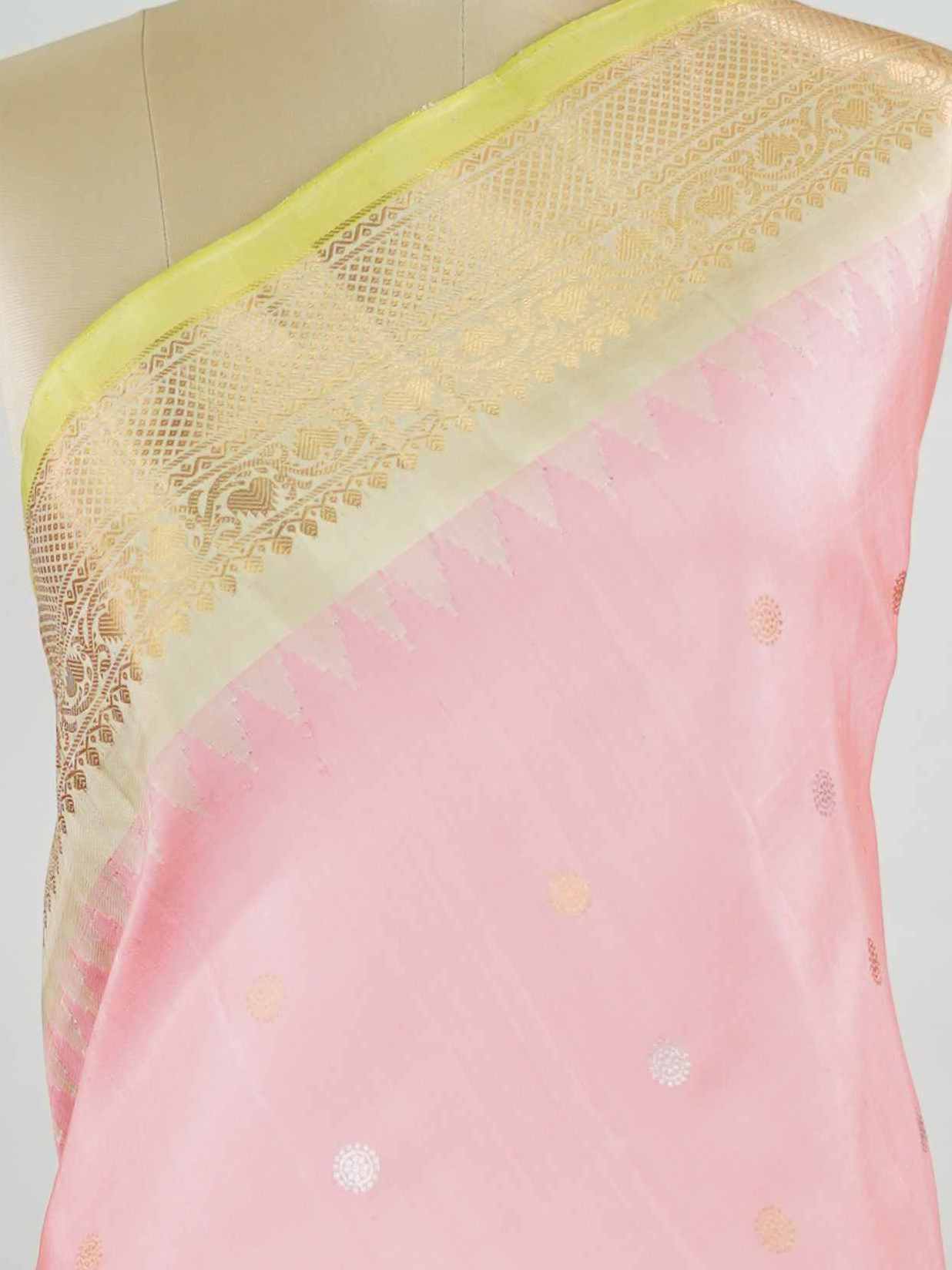 Gadwal Silk Embrace soft elegance with this Gadwal saree in a delicate baby pink shade, paired with a graceful beige blouse. /spanspanThe design is enriched with elegant gold and silver buttas that add a subtle festive glow. /spanspanIts traditional weave offers a refined drape that beautifully blends charm and sophistication. /spanspanPerfect for festive occasions, celebrations, and special gatherings that call for timeless grace. Shashwati - Handloom Gadwal Silk Saree | Pure Silk | Zari Border - Manoranji