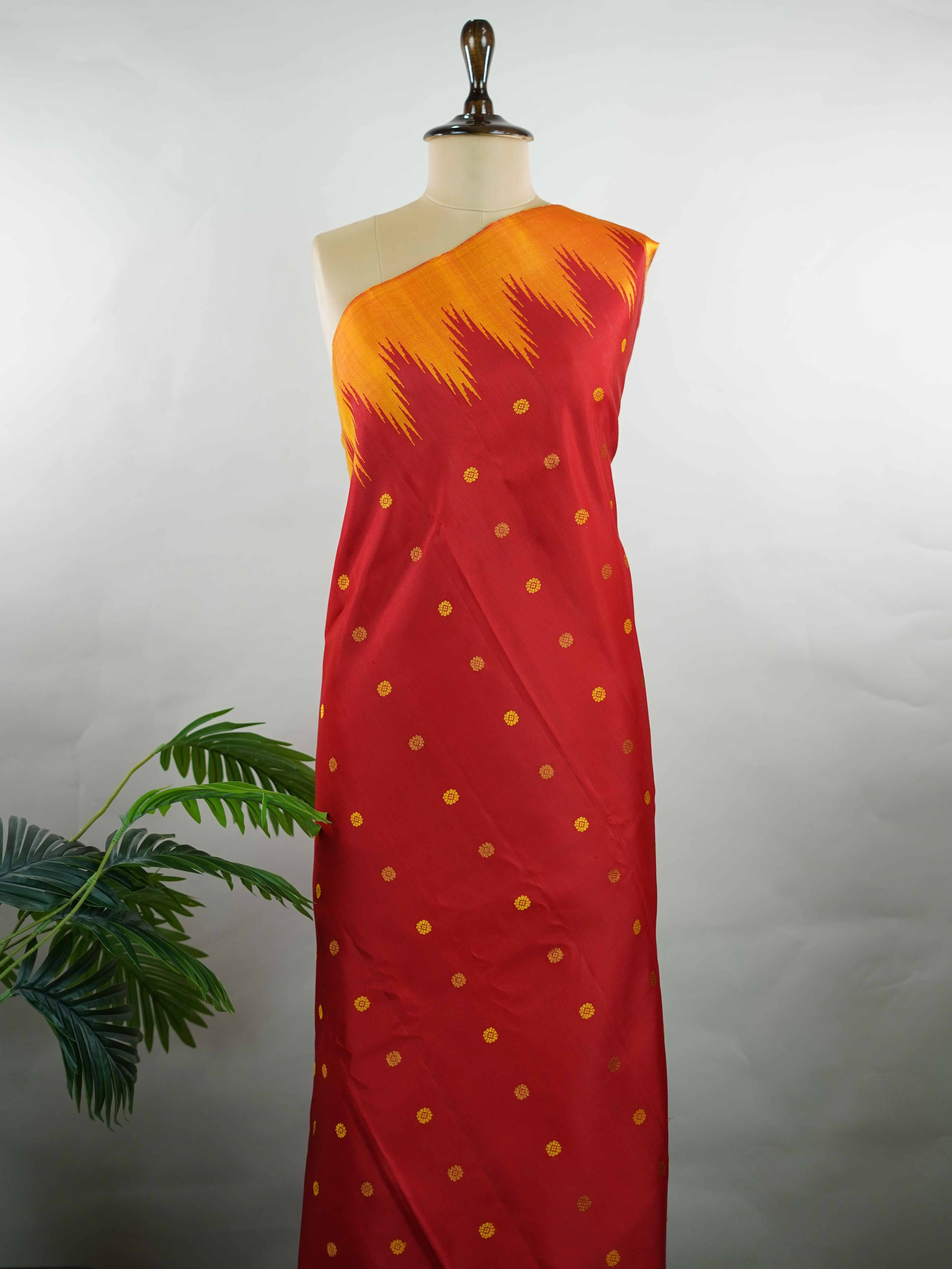 Gadwal Silk This vibrant Gadwal saree features a red body paired with a mustard border, crafted from 100% pure silk.br
The body is adorned with delicate thread buttis, while the border showcases traditional temple kota kommas for a classic touch.br
Completed with a contrasting blouse, it highlights exquisite handloom craftsmanship and timeless elegance. Ekanta - Red Handloom Gadwal Silk Saree | Pure Silk | Zari Border - Manoranjitham Weaves - Handloom Store