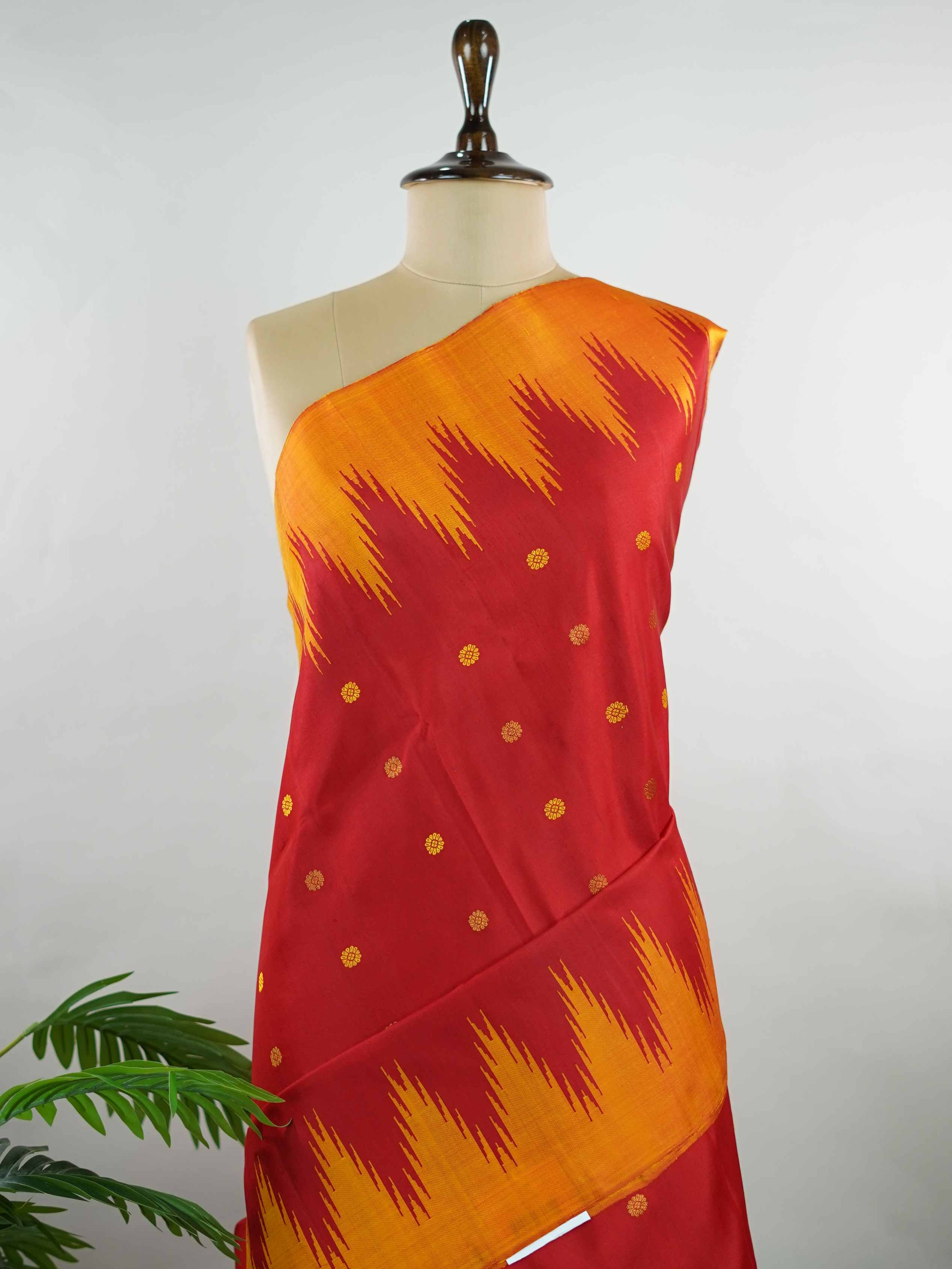 Gadwal Silk This vibrant Gadwal saree features a red body paired with a mustard border, crafted from 100% pure silk.br
The body is adorned with delicate thread buttis, while the border showcases traditional temple kota kommas for a classic touch.br
Completed with a contrasting blouse, it highlights exquisite handloom craftsmanship and timeless elegance. Ekanta - Red Handloom Gadwal Silk Saree | Pure Silk | Zari Border - Manoranjitham Weaves - Handloom Store