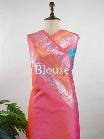 Gadwal Silk Stand out in elegance with this Gadwal saree in a rich peacock blue shade, paired beautifully with a contrasting pink blouse. The weave is adorned with silver and gold Chakram and Annapakshi buttas, showcasing exquisite traditional artistry. The fine detailing adds a regal charm, making it a perfect blend of heritage and sophistication.  Satyavati - Handloom Gadwal Silk Saree | Pure Silk | Zari Border - Manoranjitham Weaves - Handloom Store