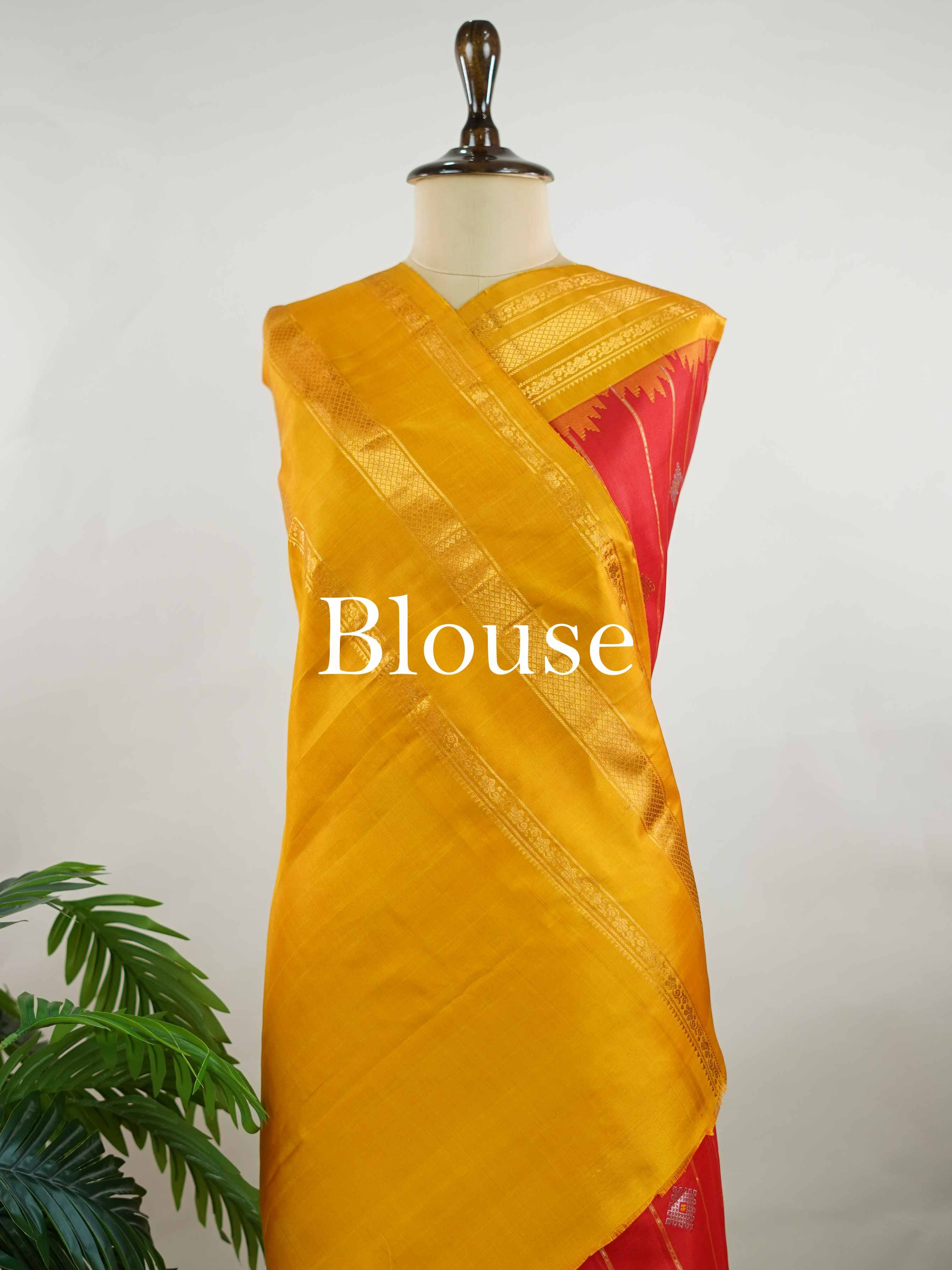 Gadwal Silk Make a striking statement with this elegant Gadwal saree in a vibrant red shade, paired beautifully with a contrasting yellow blouse. The design is adorned with intricate silver and gold kolam buttas, reflecting traditional artistry and cultural richness. The classic weave enhances its graceful drape, giving it a timeless and festive appeal. Perfect for weddings, festive celebrations, and auspicious occasions that call for a regal traditional look. Vinata - Handloom Gadwal Silk Saree | Pure Silk