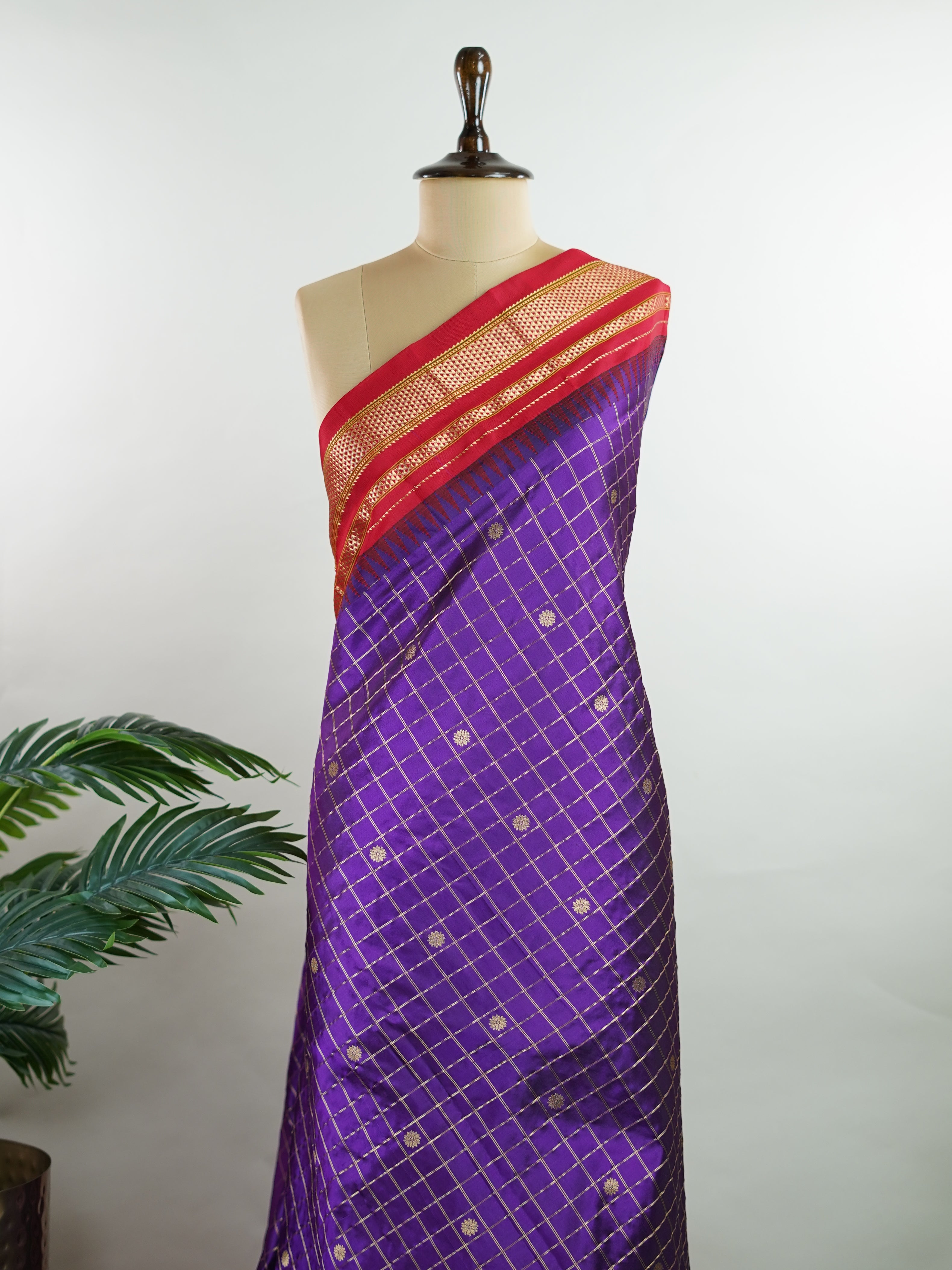 Narayanpet Narayanpet sarees with checks and buttis showcase a perfect blend of tradition and simplicity, featuring intricate motifs woven over classic check patterns.
Their vibrant colors and fine craftsmanship make them elegant choices for any occasion.
 Durga - Manoranjitham Weaves - Handloom Store
