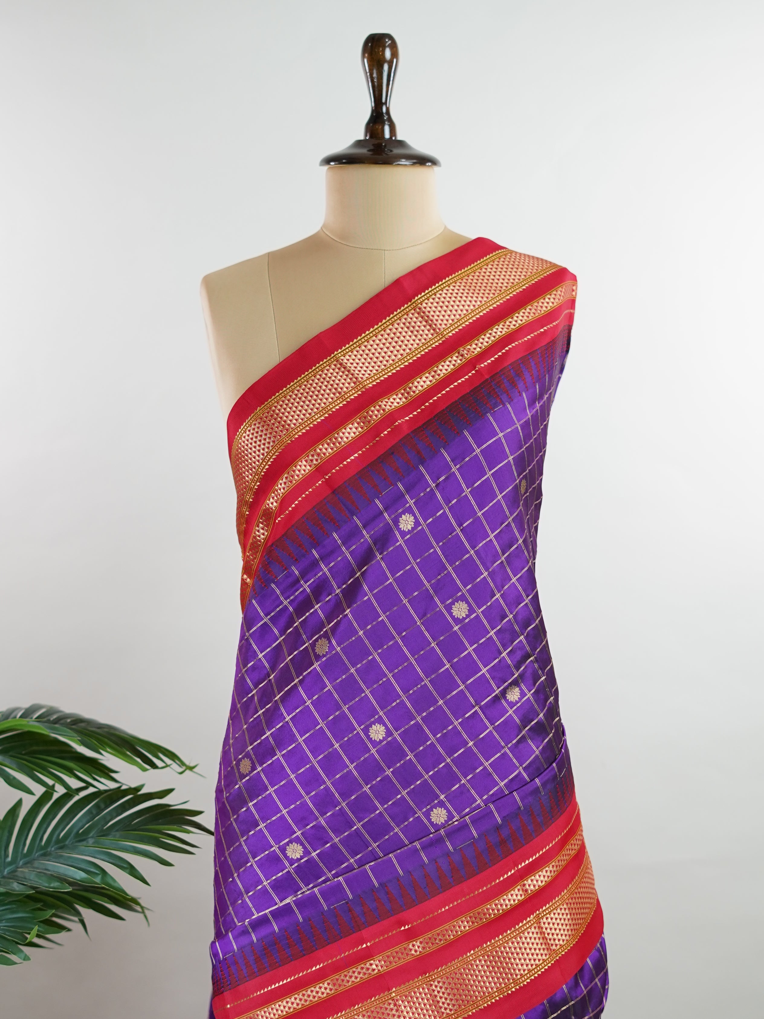 Narayanpet Narayanpet sarees with checks and buttis showcase a perfect blend of tradition and simplicity, featuring intricate motifs woven over classic check patterns.
Their vibrant colors and fine craftsmanship make them elegant choices for any occasion.
 Durga - Manoranjitham Weaves - Handloom Store