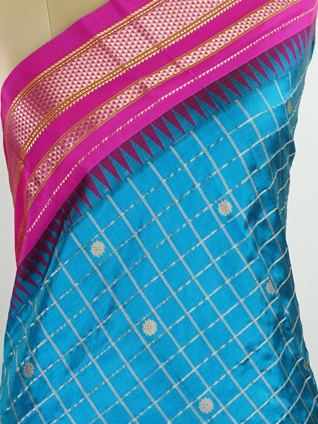 Narayanpet Narayanpet sarees with checks and buttis showcase a perfect blend of tradition and simplicity, featuring intricate motifs woven over classic check patterns.
Their vibrant colors and fine craftsmanship make them elegant choices for any occasion.
 Chandrika - Manoranjitham Weaves - Handloom Store