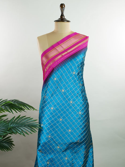 Narayanpet Narayanpet sarees with checks and buttis showcase a perfect blend of tradition and simplicity, featuring intricate motifs woven over classic check patterns.
Their vibrant colors and fine craftsmanship make them elegant choices for any occasion.
 Chandrika - Manoranjitham Weaves - Handloom Store