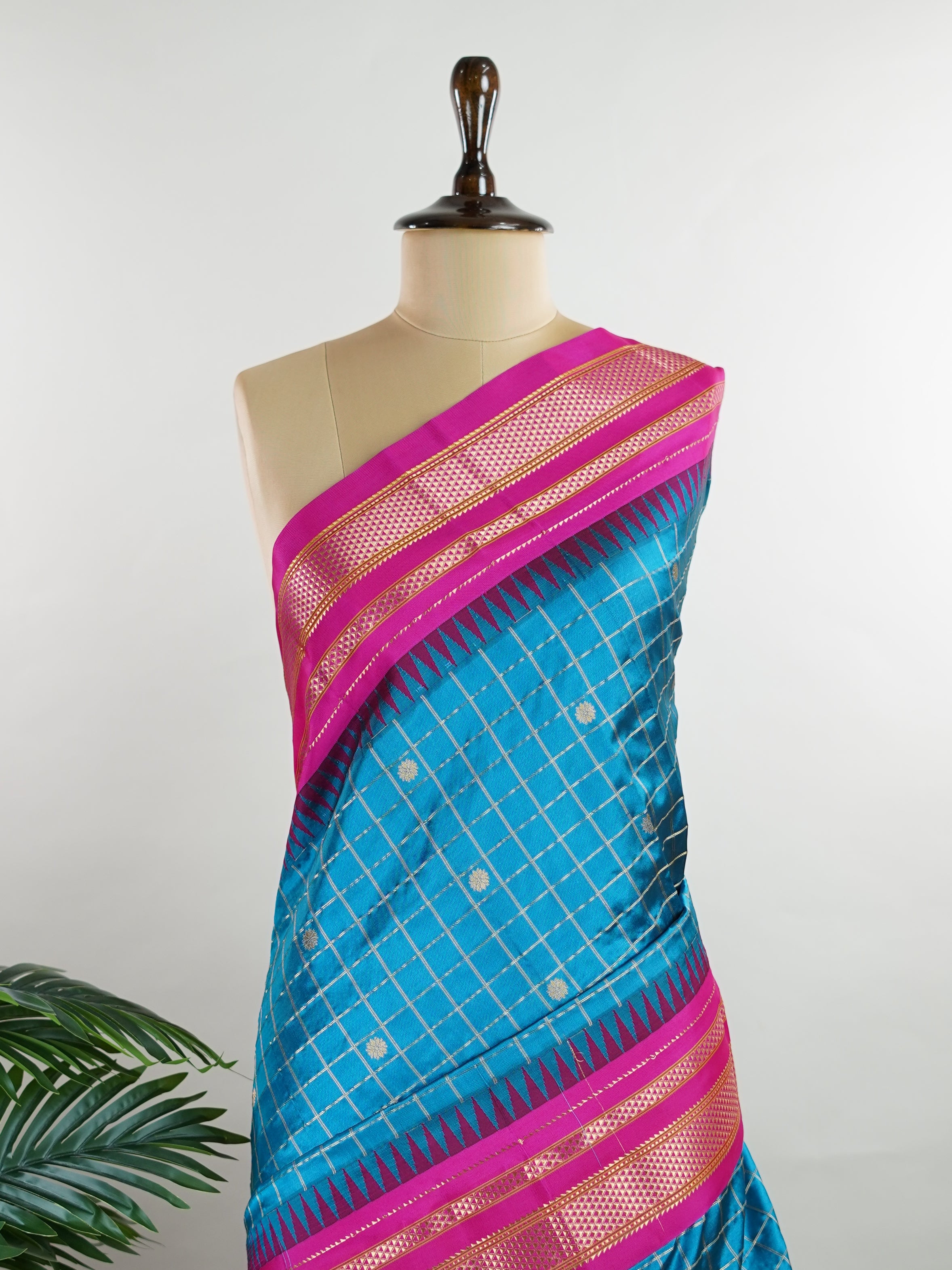 Narayanpet Narayanpet sarees with checks and buttis showcase a perfect blend of tradition and simplicity, featuring intricate motifs woven over classic check patterns.
Their vibrant colors and fine craftsmanship make them elegant choices for any occasion.
 Chandrika - Manoranjitham Weaves - Handloom Store