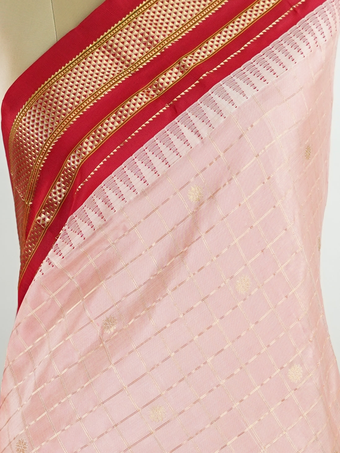 Narayanpet Narayanpet sarees with checks and buttis showcase a perfect blend of tradition and simplicity, featuring intricate motifs woven over classic check patterns.
Their vibrant colors and fine craftsmanship make them elegant choices for any occasion.
 Mitra - Manoranjitham Weaves - Handloom Store