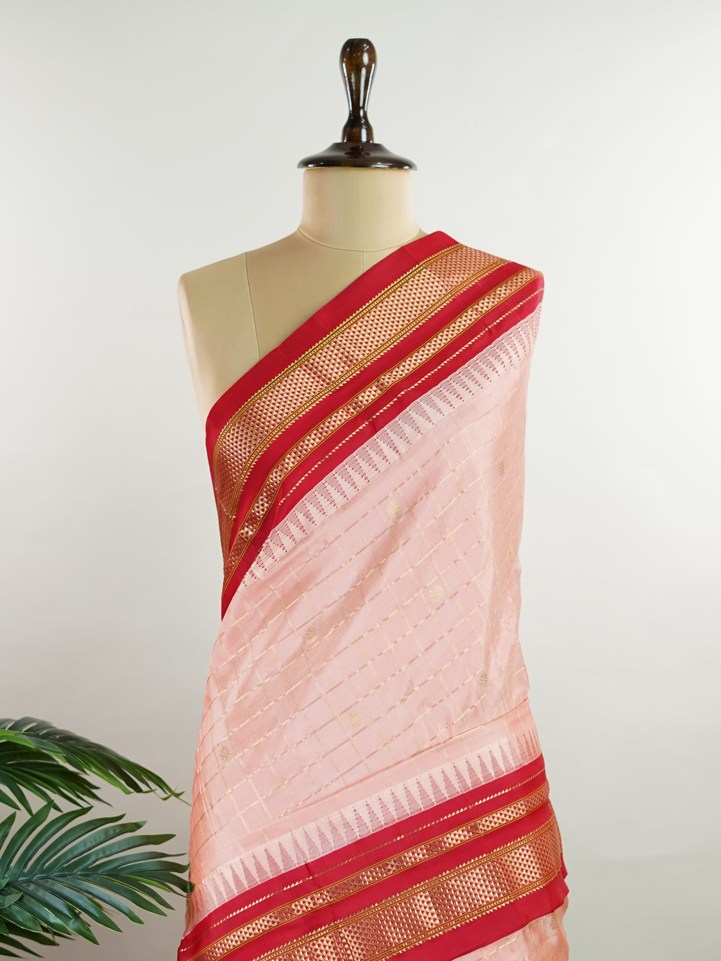 Narayanpet Narayanpet sarees with checks and buttis showcase a perfect blend of tradition and simplicity, featuring intricate motifs woven over classic check patterns.
Their vibrant colors and fine craftsmanship make them elegant choices for any occasion.
 Mitra - Manoranjitham Weaves - Handloom Store