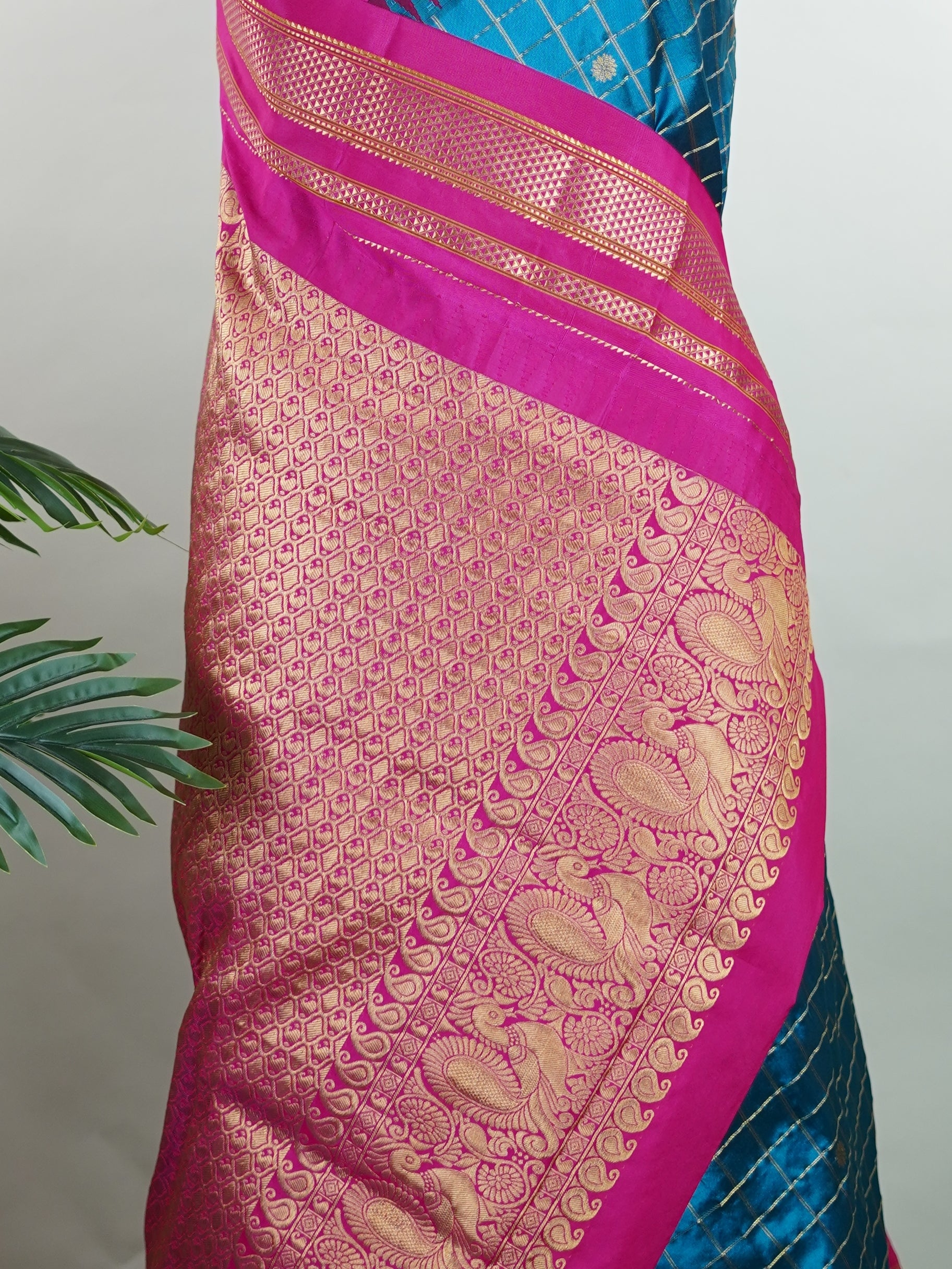 Narayanpet Narayanpet sarees with checks and buttis showcase a perfect blend of tradition and simplicity, featuring intricate motifs woven over classic check patterns.
Their vibrant colors and fine craftsmanship make them elegant choices for any occasion.
 Parvati - Manoranjitham Weaves - Handloom Store
