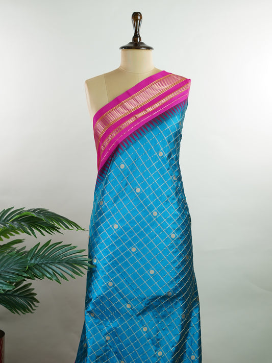 Narayanpet Narayanpet sarees with checks and buttis showcase a perfect blend of tradition and simplicity, featuring intricate motifs woven over classic check patterns.
Their vibrant colors and fine craftsmanship make them elegant choices for any occasion.
 Parvati - Manoranjitham Weaves - Handloom Store