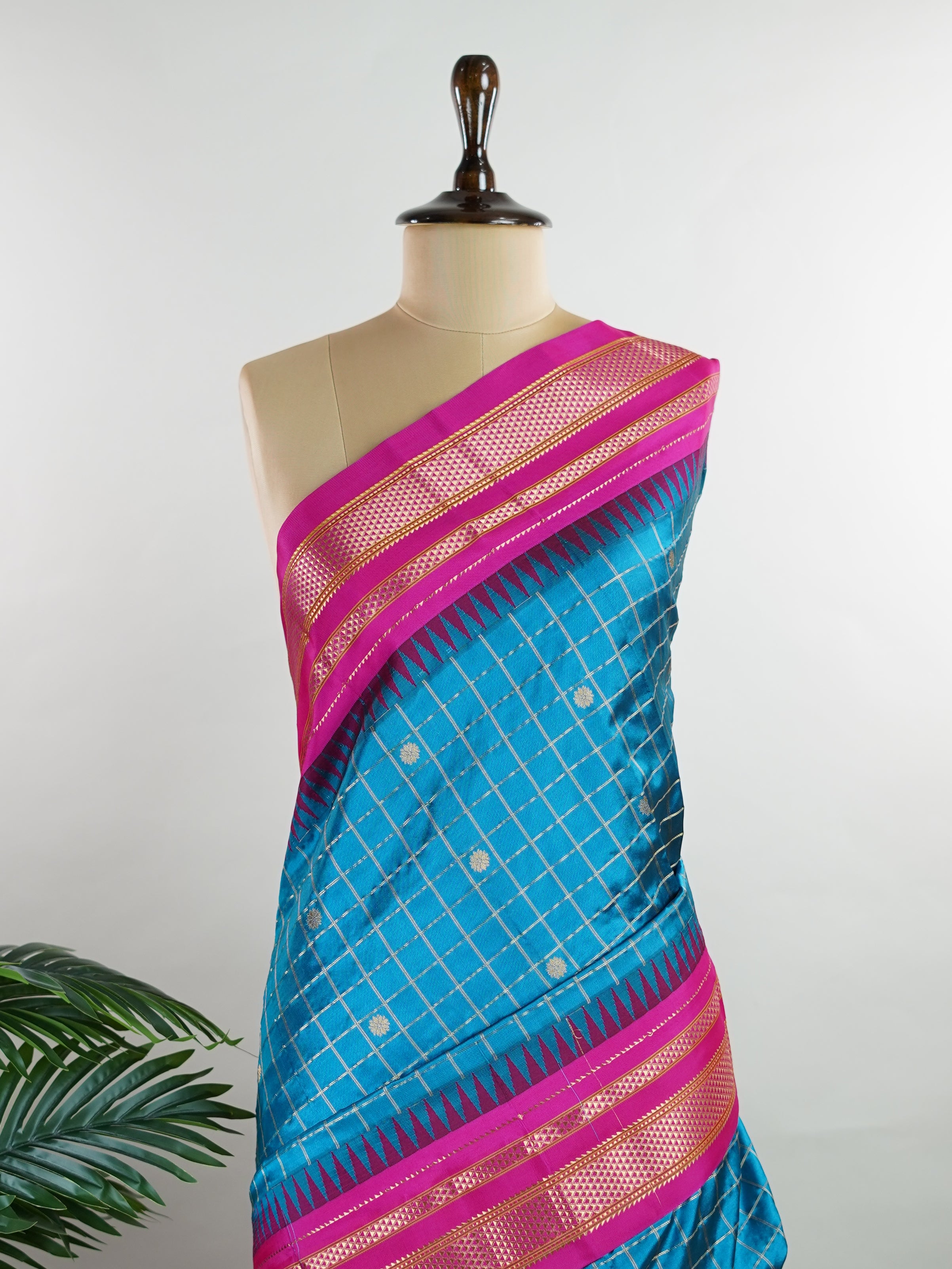 Narayanpet Narayanpet sarees with checks and buttis showcase a perfect blend of tradition and simplicity, featuring intricate motifs woven over classic check patterns.
Their vibrant colors and fine craftsmanship make them elegant choices for any occasion.
 Parvati - Manoranjitham Weaves - Handloom Store