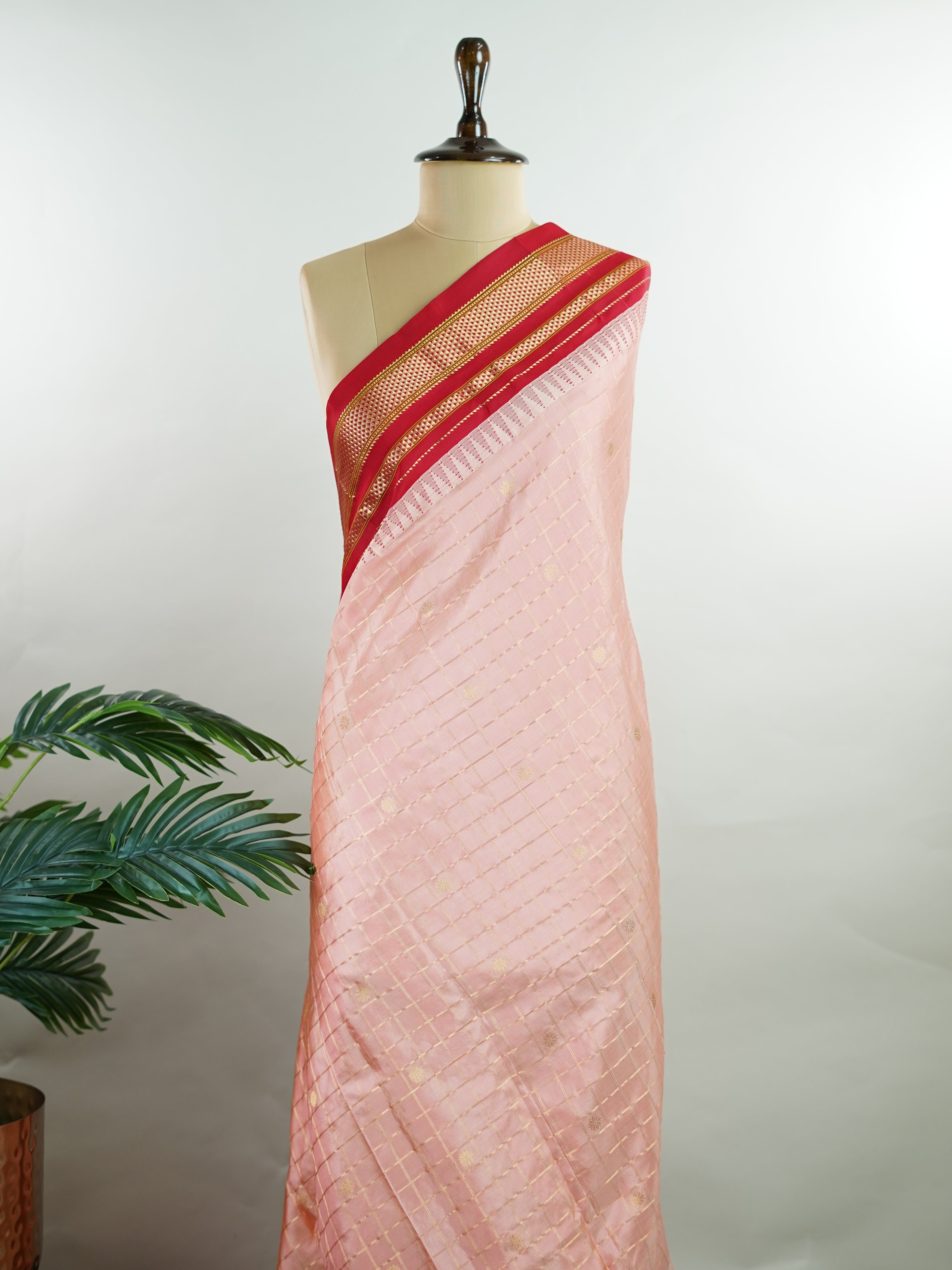 Narayanpet Narayanpet sarees with checks and buttis showcase a perfect blend of tradition and simplicity, featuring intricate motifs woven over classic check patterns.
Their vibrant colors and fine craftsmanship make them elegant choices for any occasion.
 Jaganmatha - Manoranjitham Weaves - Handloom Store