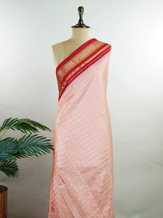 Narayanpet Narayanpet sarees with checks and buttis showcase a perfect blend of tradition and simplicity, featuring intricate motifs woven over classic check patterns.
Their vibrant colors and fine craftsmanship make them elegant choices for any occasion.
 Jaganmatha - Manoranjitham Weaves - Handloom Store