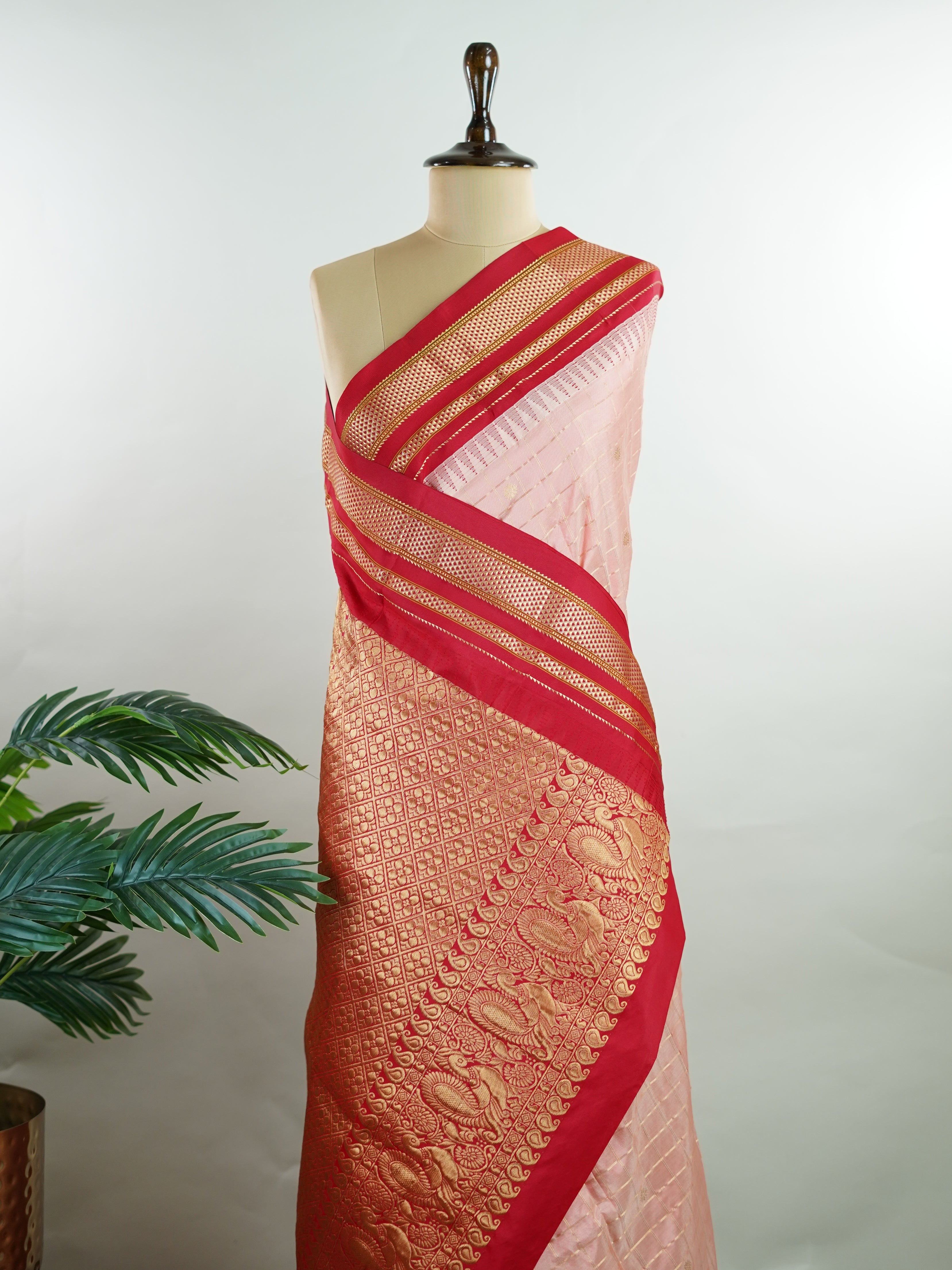 Narayanpet Narayanpet sarees with checks and buttis showcase a perfect blend of tradition and simplicity, featuring intricate motifs woven over classic check patterns.
Their vibrant colors and fine craftsmanship make them elegant choices for any occasion.
 Jaganmatha - Manoranjitham Weaves - Handloom Store