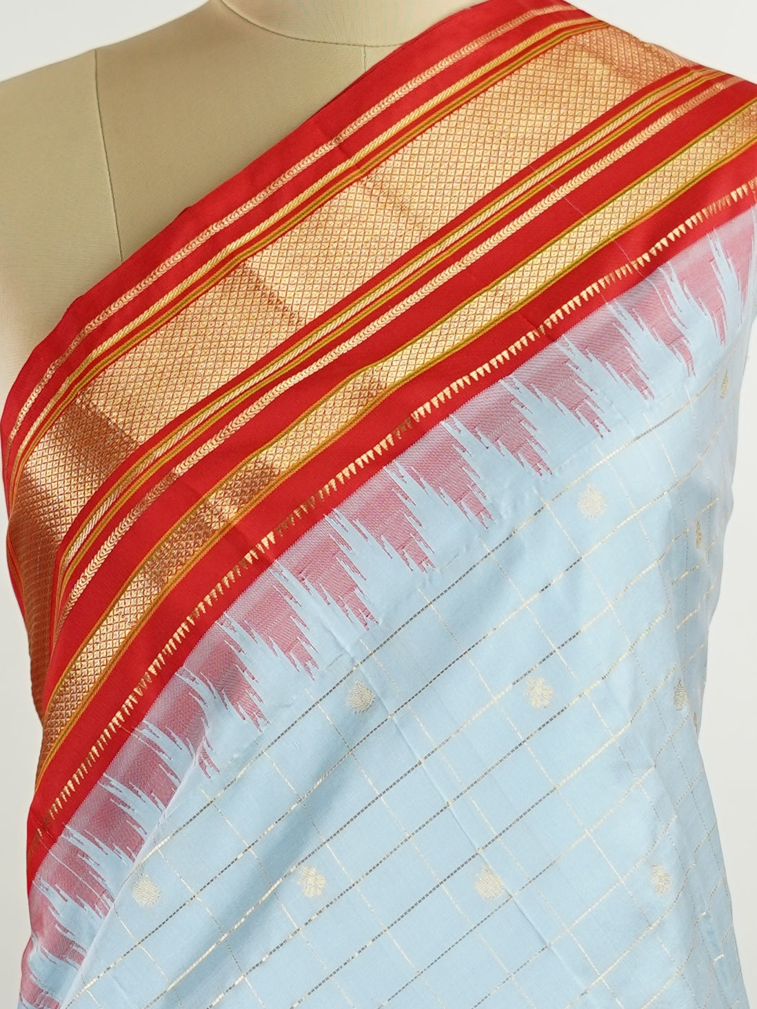 Narayanpet Narayanpet sarees with checks and buttis showcase a perfect blend of tradition and simplicity, featuring intricate motifs woven over classic check patterns.
Their vibrant colors and fine craftsmanship make them elegant choices for any occasion.
 Sowmitri - Manoranjitham Weaves - Handloom Store