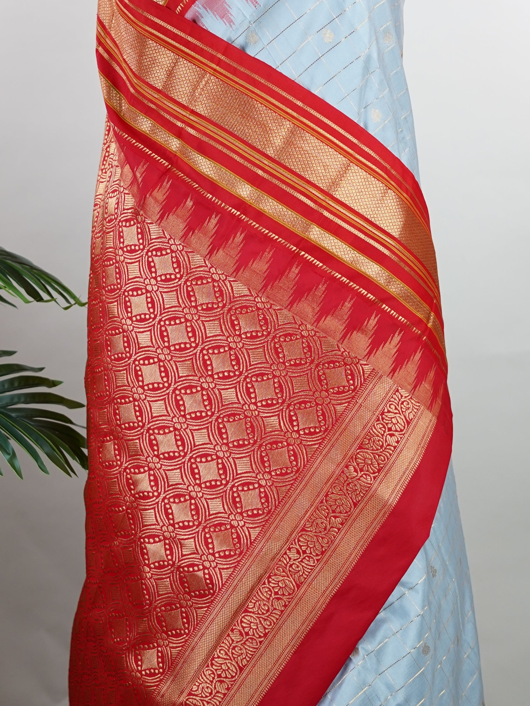 Narayanpet Narayanpet sarees with checks and buttis showcase a perfect blend of tradition and simplicity, featuring intricate motifs woven over classic check patterns.
Their vibrant colors and fine craftsmanship make them elegant choices for any occasion.
 Sowmitri - Manoranjitham Weaves - Handloom Store