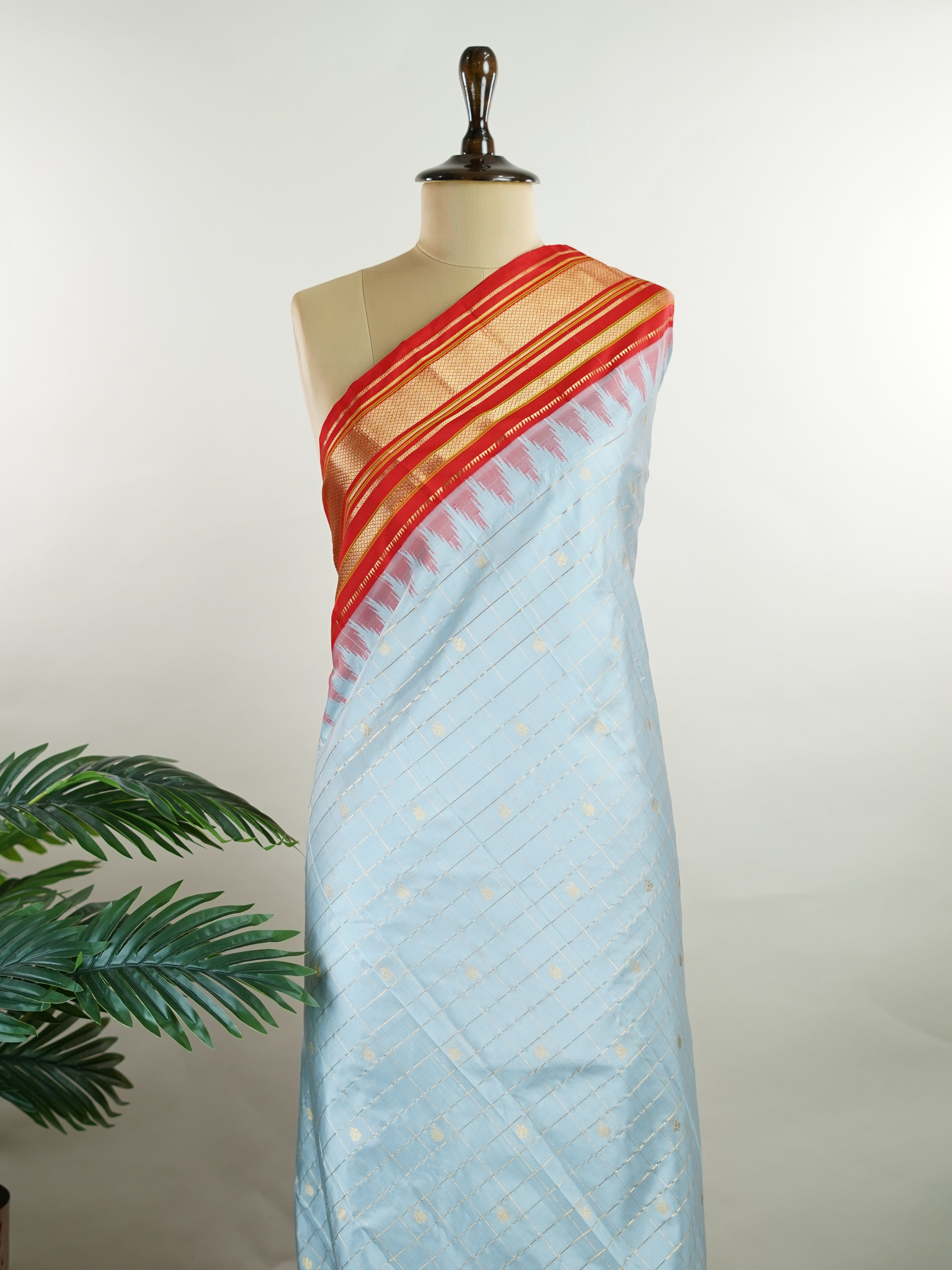 Narayanpet Narayanpet sarees with checks and buttis showcase a perfect blend of tradition and simplicity, featuring intricate motifs woven over classic check patterns.
Their vibrant colors and fine craftsmanship make them elegant choices for any occasion.
 Sowmitri - Manoranjitham Weaves - Handloom Store