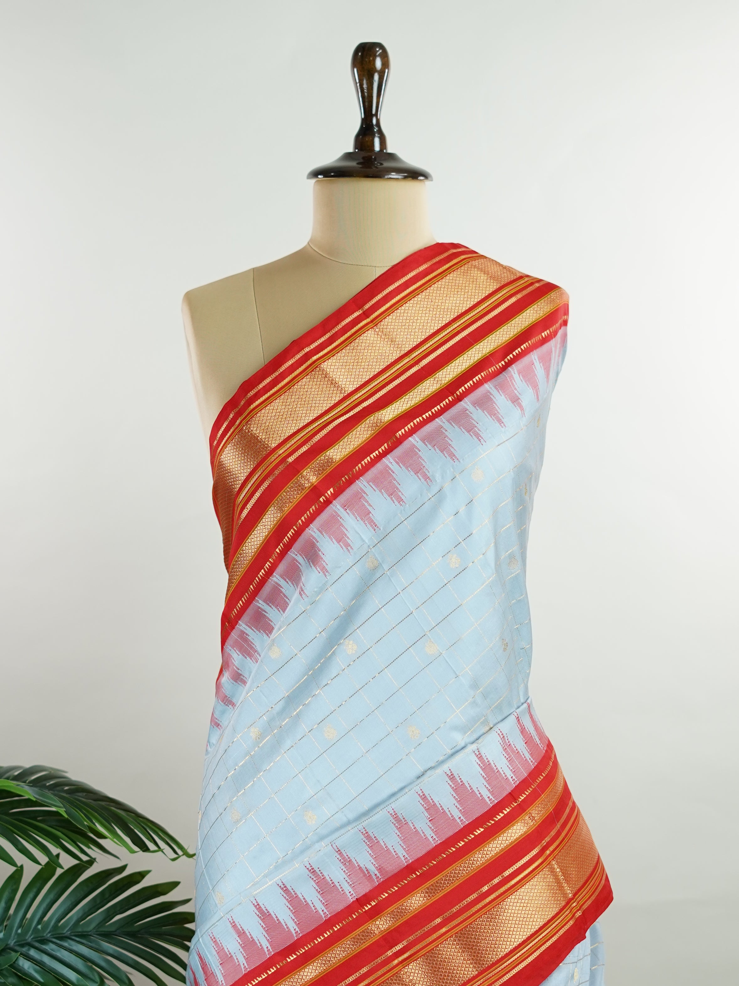 Narayanpet Narayanpet sarees with checks and buttis showcase a perfect blend of tradition and simplicity, featuring intricate motifs woven over classic check patterns.
Their vibrant colors and fine craftsmanship make them elegant choices for any occasion.
 Sowmitri - Manoranjitham Weaves - Handloom Store
