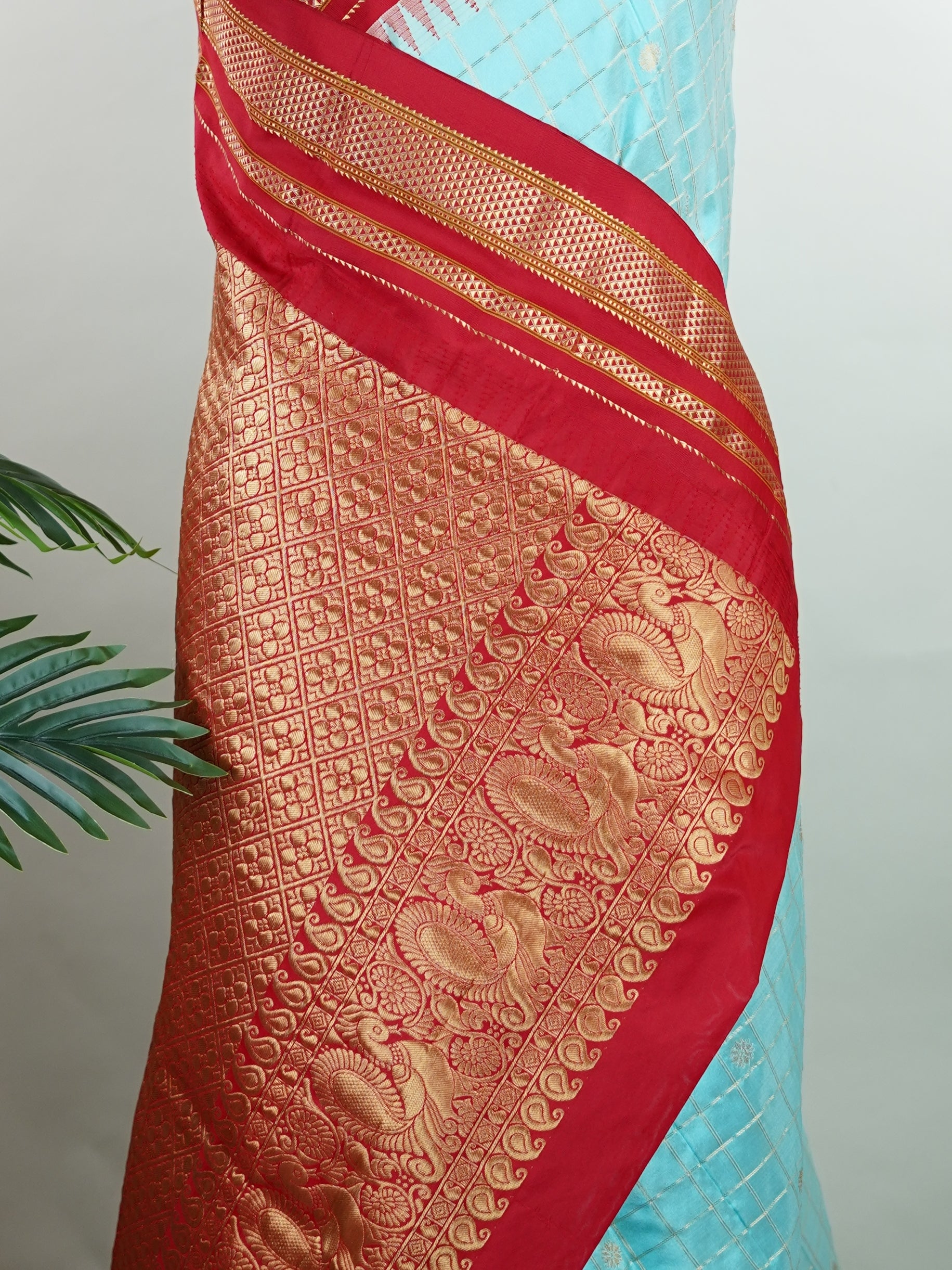 Narayanpet Narayanpet sarees with checks and buttis showcase a perfect blend of tradition and simplicity, featuring intricate motifs woven over classic check patterns.
Their vibrant colors and fine craftsmanship make them elegant choices for any occasion.
 Soundarya - Manoranjitham Weaves - Handloom Store