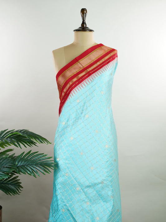Narayanpet Narayanpet sarees with checks and buttis showcase a perfect blend of tradition and simplicity, featuring intricate motifs woven over classic check patterns.
Their vibrant colors and fine craftsmanship make them elegant choices for any occasion.
 Soundarya - Manoranjitham Weaves - Handloom Store