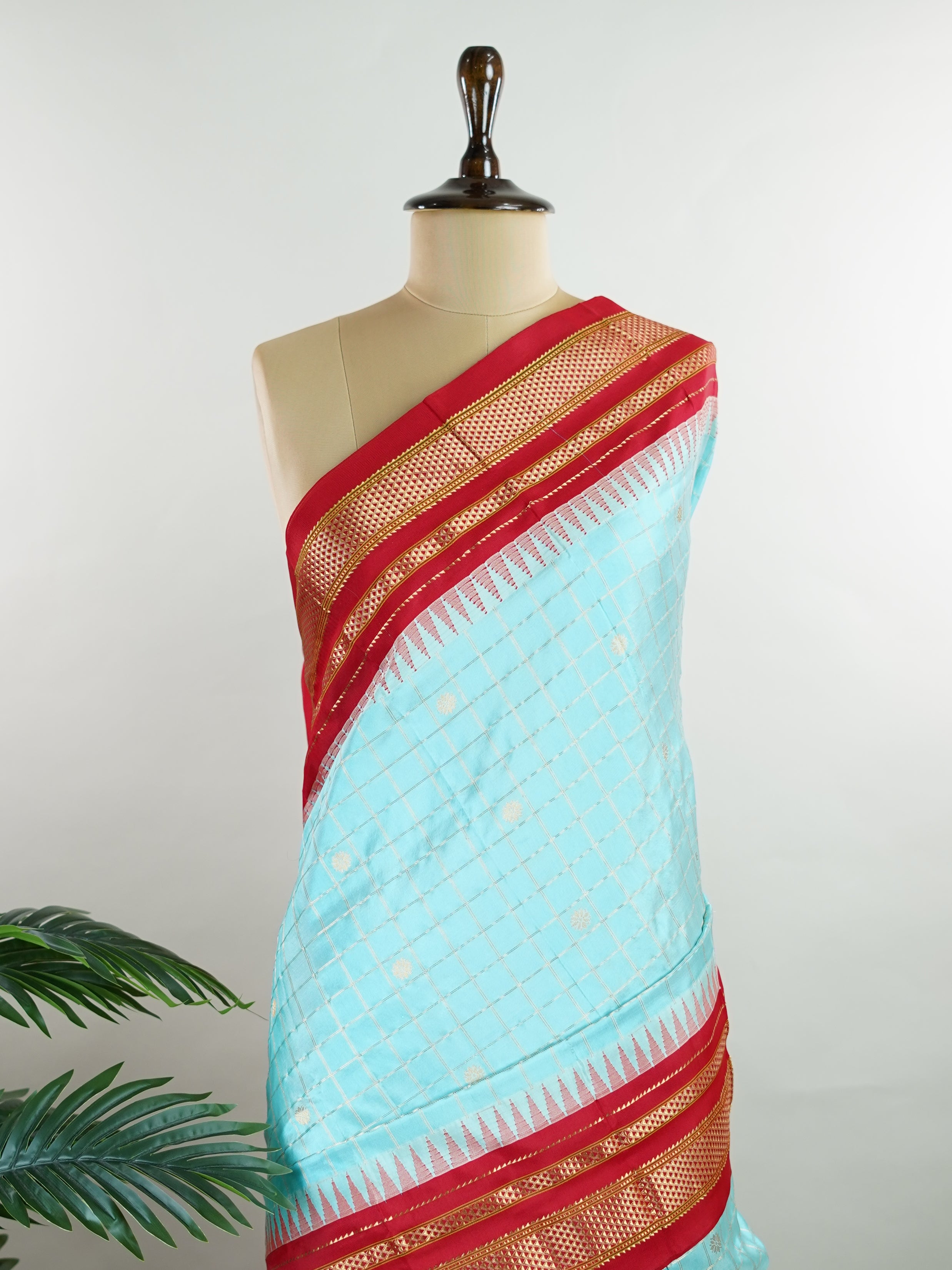 Narayanpet Narayanpet sarees with checks and buttis showcase a perfect blend of tradition and simplicity, featuring intricate motifs woven over classic check patterns.
Their vibrant colors and fine craftsmanship make them elegant choices for any occasion.
 Soundarya - Manoranjitham Weaves - Handloom Store
