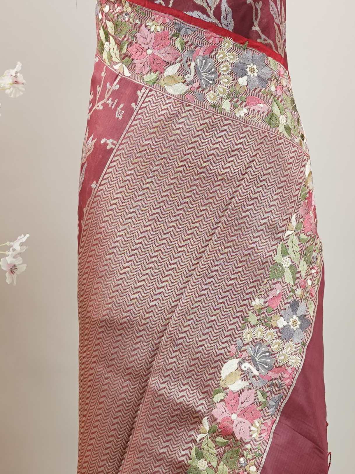 Katan The fluid charm of Banaras soft silk finds poetry in Parsi Gara florals.br
A union of two timeless crafts in one masterpiece. Savitri - Handwork Embroidered Silk Saree | Parsigara Embroidery - Manoranjitham Weaves - Handloom Store
