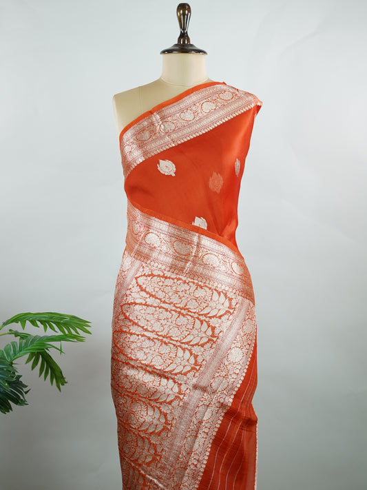 Katan This kora saree features delicate woven buttis and offers a light, comfortable drape. Parijata - Manoranjitham Weaves - Handloom Store