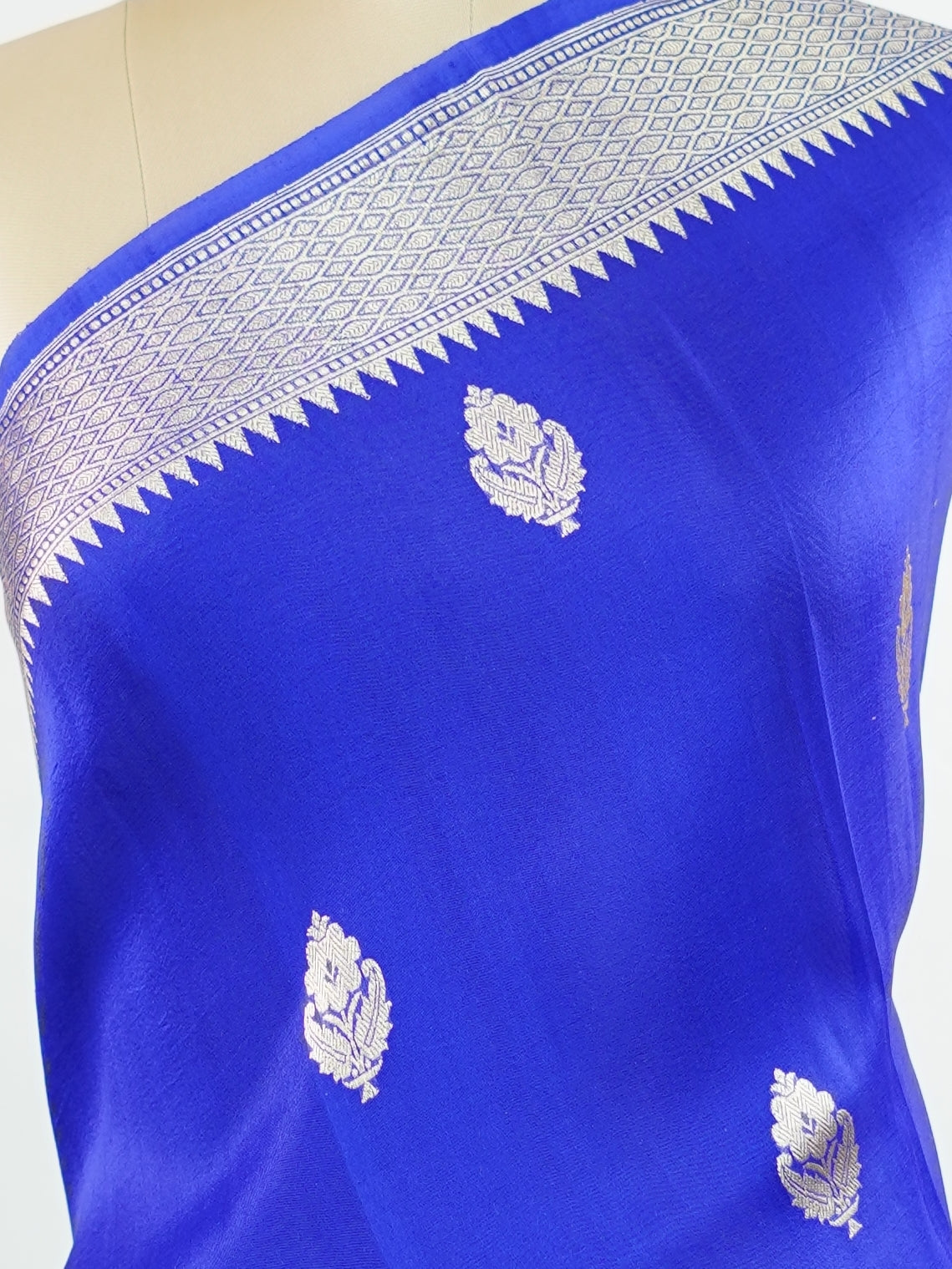 Katan This kora saree features delicate woven buttis and offers a light, comfortable drape. Isha - Banarasi Kora Saree | Woven Buttas - Manoranjitham Weaves - Handloom Store