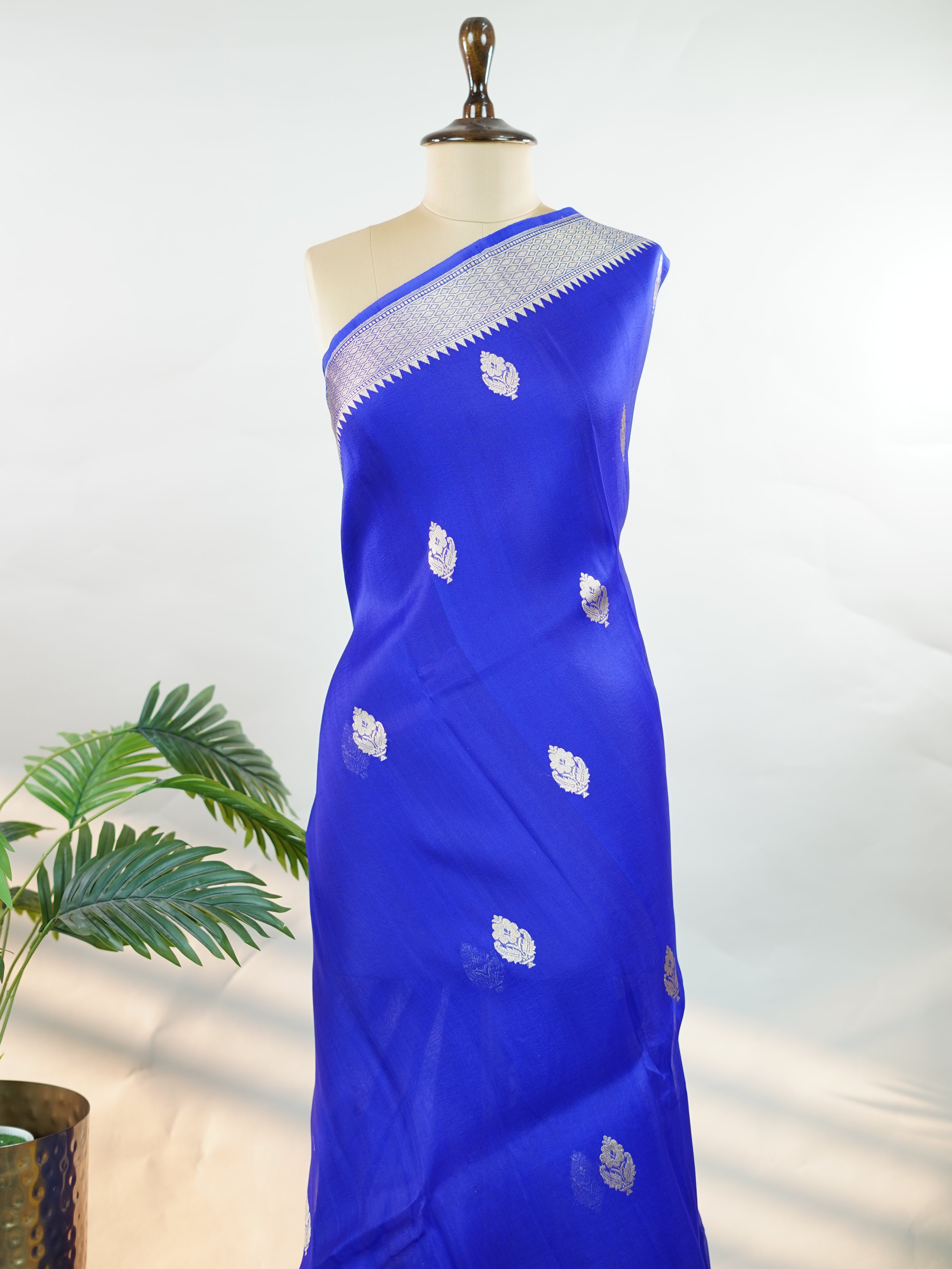 Katan This kora saree features delicate woven buttis and offers a light, comfortable drape. Isha - Banarasi Kora Saree | Woven Buttas - Manoranjitham Weaves - Handloom Store