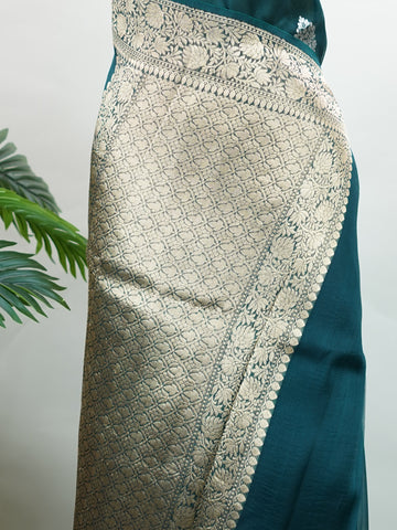Katan This kora saree features delicate woven buttis and offers a light, comfortable drape. Saranga - Banarasi Kora Saree | Woven Buttas - Manoranjitham Weaves - Handloom Store
