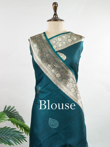 Katan This kora saree features delicate woven buttis and offers a light, comfortable drape. Saranga - Banarasi Kora Saree | Woven Buttas - Manoranjitham Weaves - Handloom Store