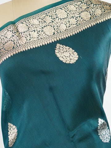 Katan This kora saree features delicate woven buttis and offers a light, comfortable drape. Saranga - Banarasi Kora Saree | Woven Buttas - Manoranjitham Weaves - Handloom Store