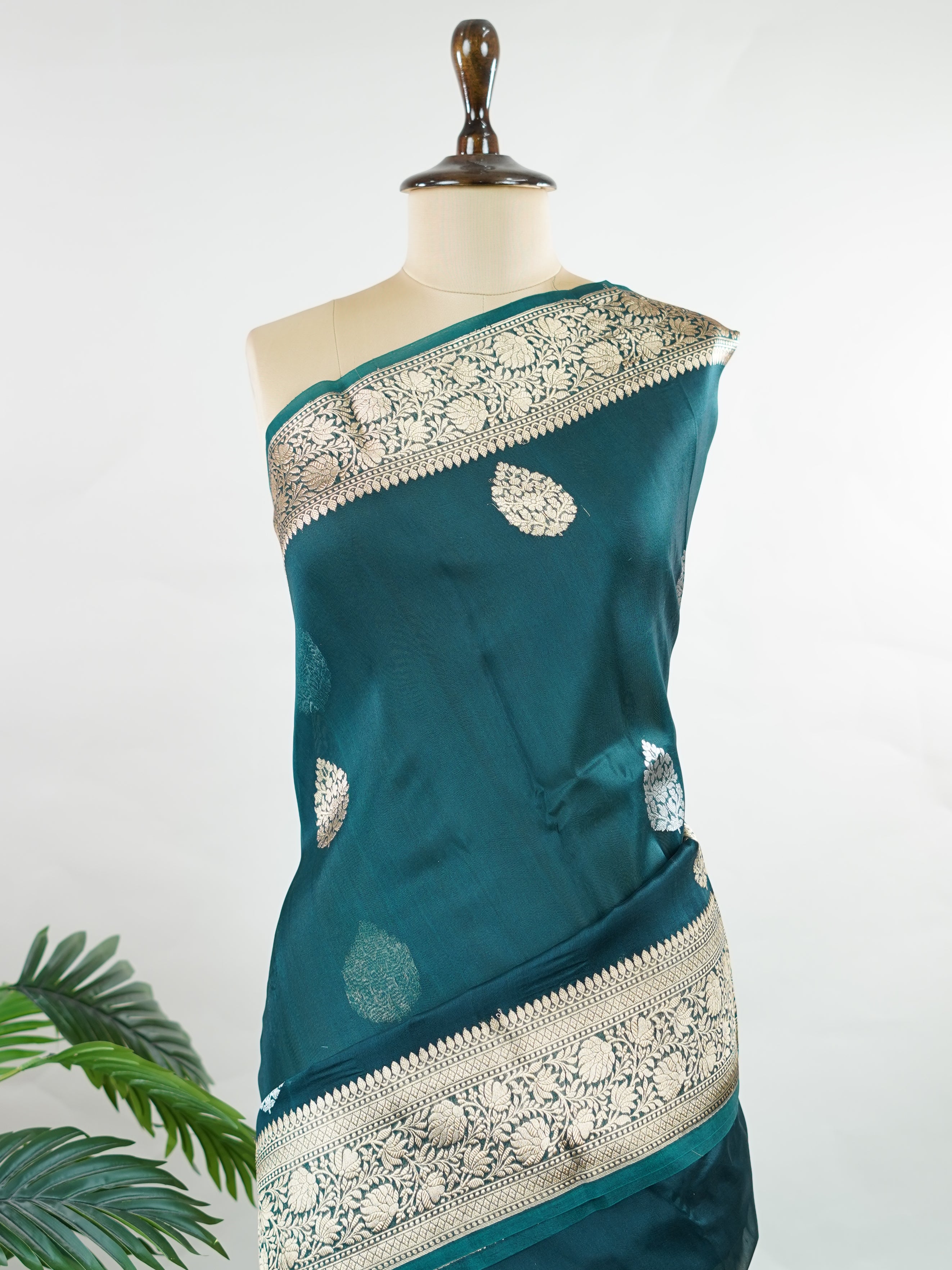 Katan This kora saree features delicate woven buttis and offers a light, comfortable drape. Saranga - Banarasi Kora Saree | Woven Buttas - Manoranjitham Weaves - Handloom Store