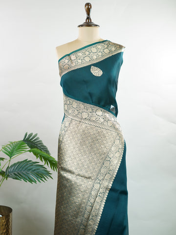 Katan This kora saree features delicate woven buttis and offers a light, comfortable drape. Saranga - Banarasi Kora Saree | Woven Buttas - Manoranjitham Weaves - Handloom Store