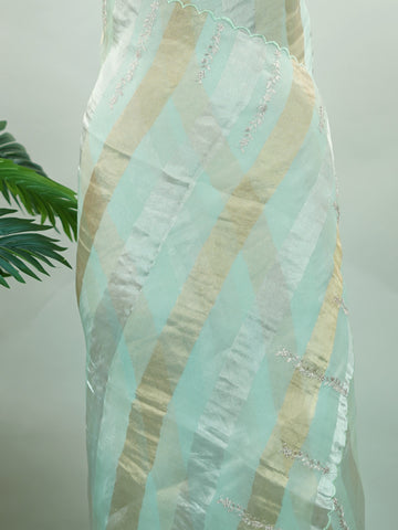 Organza This elegant organza saree features beautiful Ari Pita work on a refreshing sea green body.br data-start=91 data-end=94The border is finely detailed with intricate embroidery, adding a delicate traditional charm.br data-start=187 data-end=190The pallu showcases rich Ari Pita craftsmanship, enhancing its graceful and artistic appeal.br data-start=282 data-end=285Perfect for festive and special occasions, it reflects a light, airy, and elegant ethnic look. Subha - Organza Saree | Embroidered - Manoran