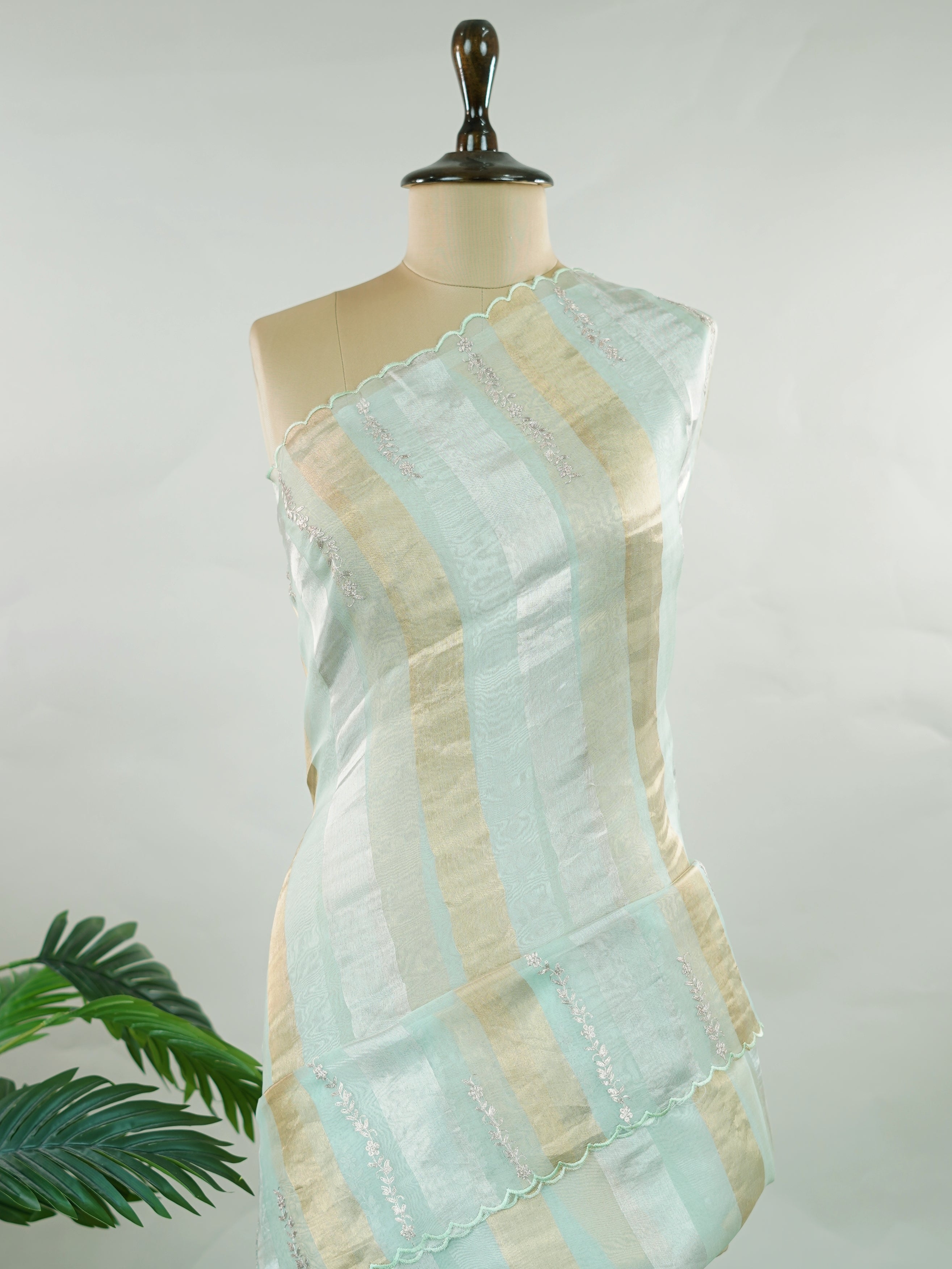 Organza This elegant organza saree features beautiful Ari Pita work on a refreshing sea green body.br data-start=91 data-end=94The border is finely detailed with intricate embroidery, adding a delicate traditional charm.br data-start=187 data-end=190The pallu showcases rich Ari Pita craftsmanship, enhancing its graceful and artistic appeal.br data-start=282 data-end=285Perfect for festive and special occasions, it reflects a light, airy, and elegant ethnic look. Subha - Organza Saree | Embroidered - Manoran
