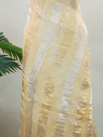 Organza Elegant organza saree in gold and cream hues featuring exquisite Aari Peeta work on the pallu. The sheer, lightweight fabric drapes gracefully, creating a regal and refined silhouette.br data-start=186 data-end=189Intricate handcrafted embroidery adds richness, texture, and timeless traditional charm.br data-start=277 data-end=280Perfect for weddings, festive celebrations, and special occasions with classic elegance. Dhanya - Organza Saree | Embroidered - Manoranjitham Weaves - Handloom Store
