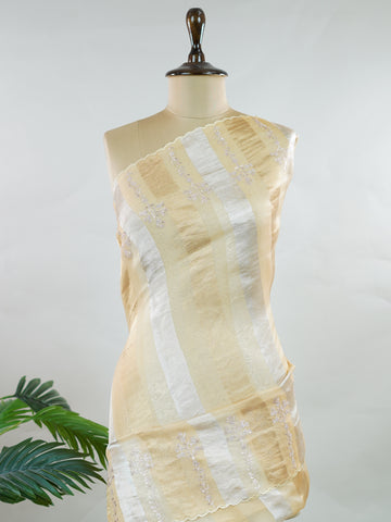 Organza Elegant organza saree in gold and cream hues featuring exquisite Aari Peeta work on the pallu. The sheer, lightweight fabric drapes gracefully, creating a regal and refined silhouette.br data-start=186 data-end=189Intricate handcrafted embroidery adds richness, texture, and timeless traditional charm.br data-start=277 data-end=280Perfect for weddings, festive celebrations, and special occasions with classic elegance. Dhanya - Organza Saree | Embroidered - Manoranjitham Weaves - Handloom Store