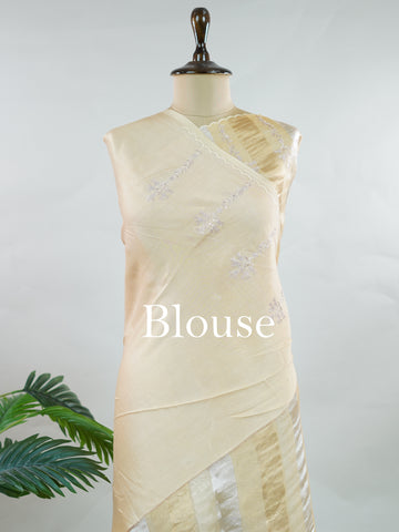 Organza Elegant organza saree in gold and cream hues featuring exquisite Aari Peeta work on the pallu. The sheer, lightweight fabric drapes gracefully, creating a regal and refined silhouette.br data-start=186 data-end=189Intricate handcrafted embroidery adds richness, texture, and timeless traditional charm.br data-start=277 data-end=280Perfect for weddings, festive celebrations, and special occasions with classic elegance. Dhanya - Organza Saree | Embroidered - Manoranjitham Weaves - Handloom Store