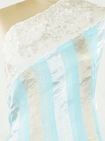 Organza Elegant organza saree in sky blue and white tones featuring intricate Aari Peeta work on the pallu. The sheer, lightweight fabric drapes beautifully, giving a fresh and graceful silhouette.br data-start=191 data-end=194Delicate handcrafted embroidery adds depth, charm, and timeless sophistication.br data-start=273 data-end=276Perfect for weddings, festive celebrations, and special occasions with serene ethnic elegance. Rhea - Organza Saree | Embroidered - Manoranjitham Weaves - Handloom Store