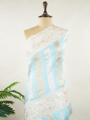 Organza Elegant organza saree in sky blue and white tones featuring intricate Aari Peeta work on the pallu. The sheer, lightweight fabric drapes beautifully, giving a fresh and graceful silhouette.br data-start=191 data-end=194Delicate handcrafted embroidery adds depth, charm, and timeless sophistication.br data-start=273 data-end=276Perfect for weddings, festive celebrations, and special occasions with serene ethnic elegance. Rhea - Organza Saree | Embroidered - Manoranjitham Weaves - Handloom Store
