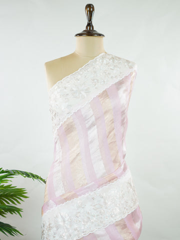 Organza Elegant organza saree in pink and white tones featuring delicate Aari Peeta work on the pallu. The sheer, lightweight fabric drapes softly, giving a graceful and feminine silhouette.br data-start=184 data-end=187Intricate handcrafted embroidery enhances its charm with rich detail and subtle elegance.br data-start=276 data-end=279Perfect for weddings, festive celebrations, and special occasions with timeless ethnic beauty. Aira - Organza Saree | Embroidered - Manoranjitham Weaves - Handloom Store