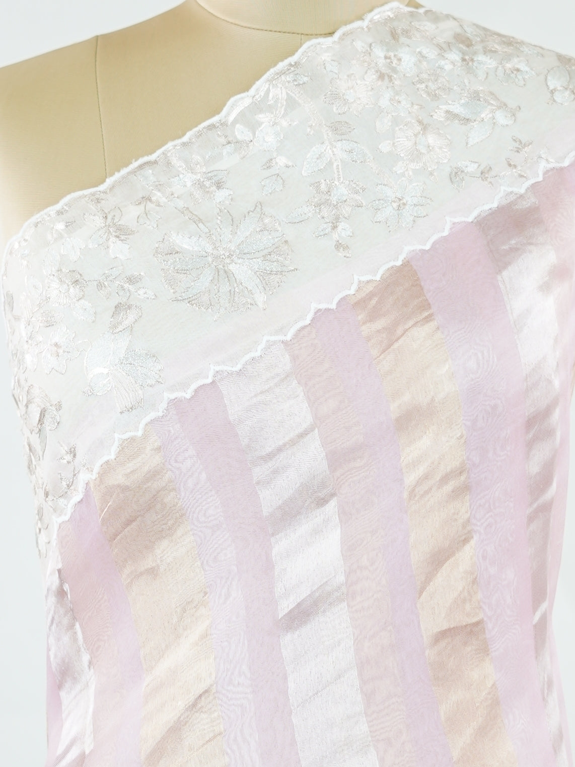 Organza Elegant organza saree in pink and white tones featuring delicate Aari Peeta work on the pallu. The sheer, lightweight fabric drapes softly, giving a graceful and feminine silhouette.br data-start=184 data-end=187Intricate handcrafted embroidery enhances its charm with rich detail and subtle elegance.br data-start=276 data-end=279Perfect for weddings, festive celebrations, and special occasions with timeless ethnic beauty. Aira - Organza Saree | Embroidered - Manoranjitham Weaves - Handloom Store