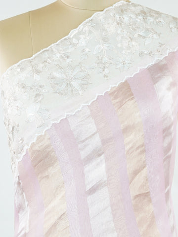 Organza Elegant organza saree in pink and white tones featuring delicate Aari Peeta work on the pallu. The sheer, lightweight fabric drapes softly, giving a graceful and feminine silhouette.br data-start=184 data-end=187Intricate handcrafted embroidery enhances its charm with rich detail and subtle elegance.br data-start=276 data-end=279Perfect for weddings, festive celebrations, and special occasions with timeless ethnic beauty. Aira - Organza Saree | Embroidered - Manoranjitham Weaves - Handloom Store