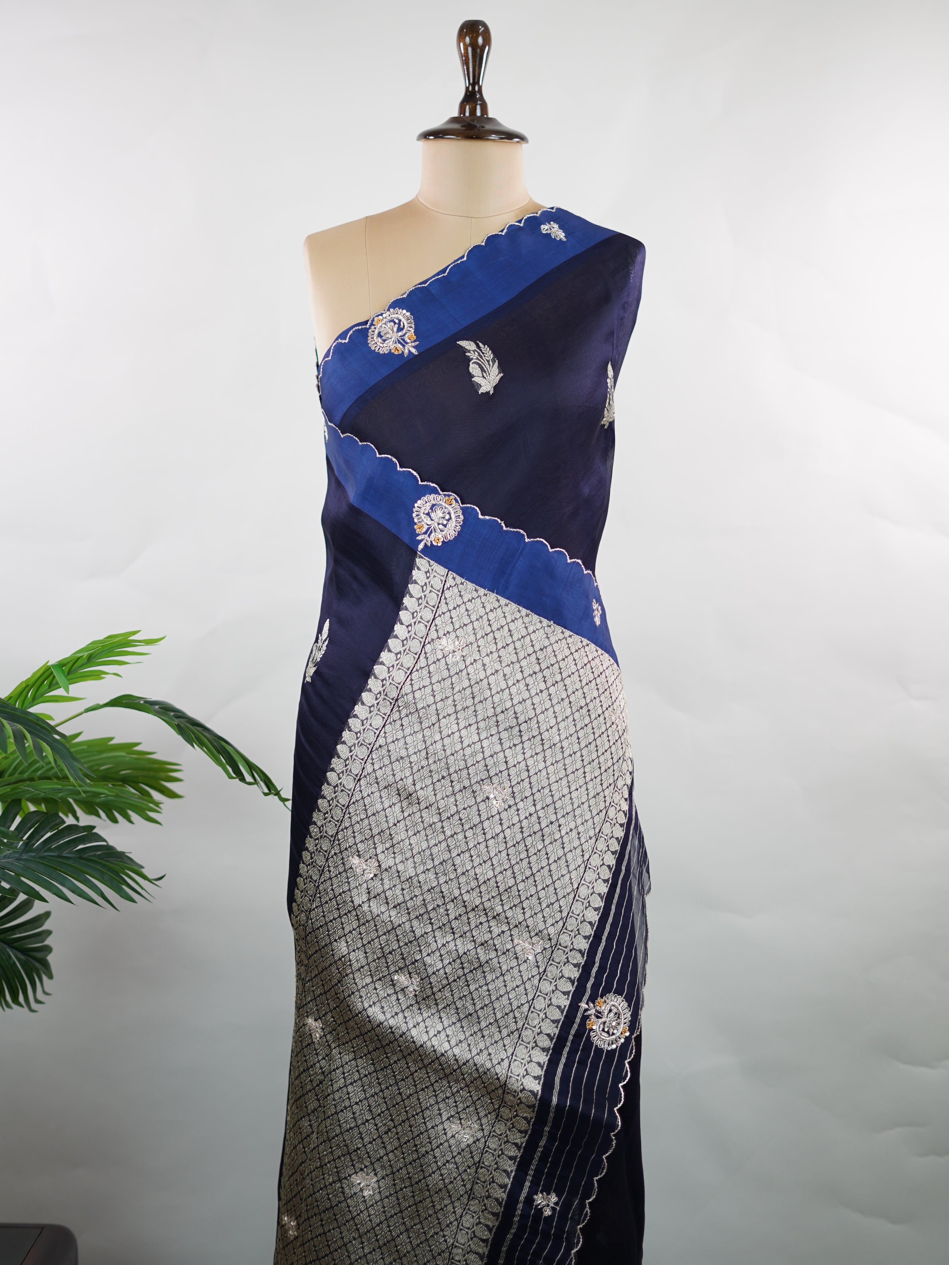 Organza Stunning dark blue organza saree adorned with elegant embroidery for a regal look.br data-start=82 data-end=85The sheer, lightweight fabric offers a graceful drape and effortless sophistication.br data-start=169 data-end=172Intricate embroidered work adds depth, texture, and timeless charm.br data-start=239 data-end=242Perfect for weddings, festive gatherings, and evening celebrations. Kiara - Organza Saree | Embroidered - Manoranjitham Weaves - Handloom Store