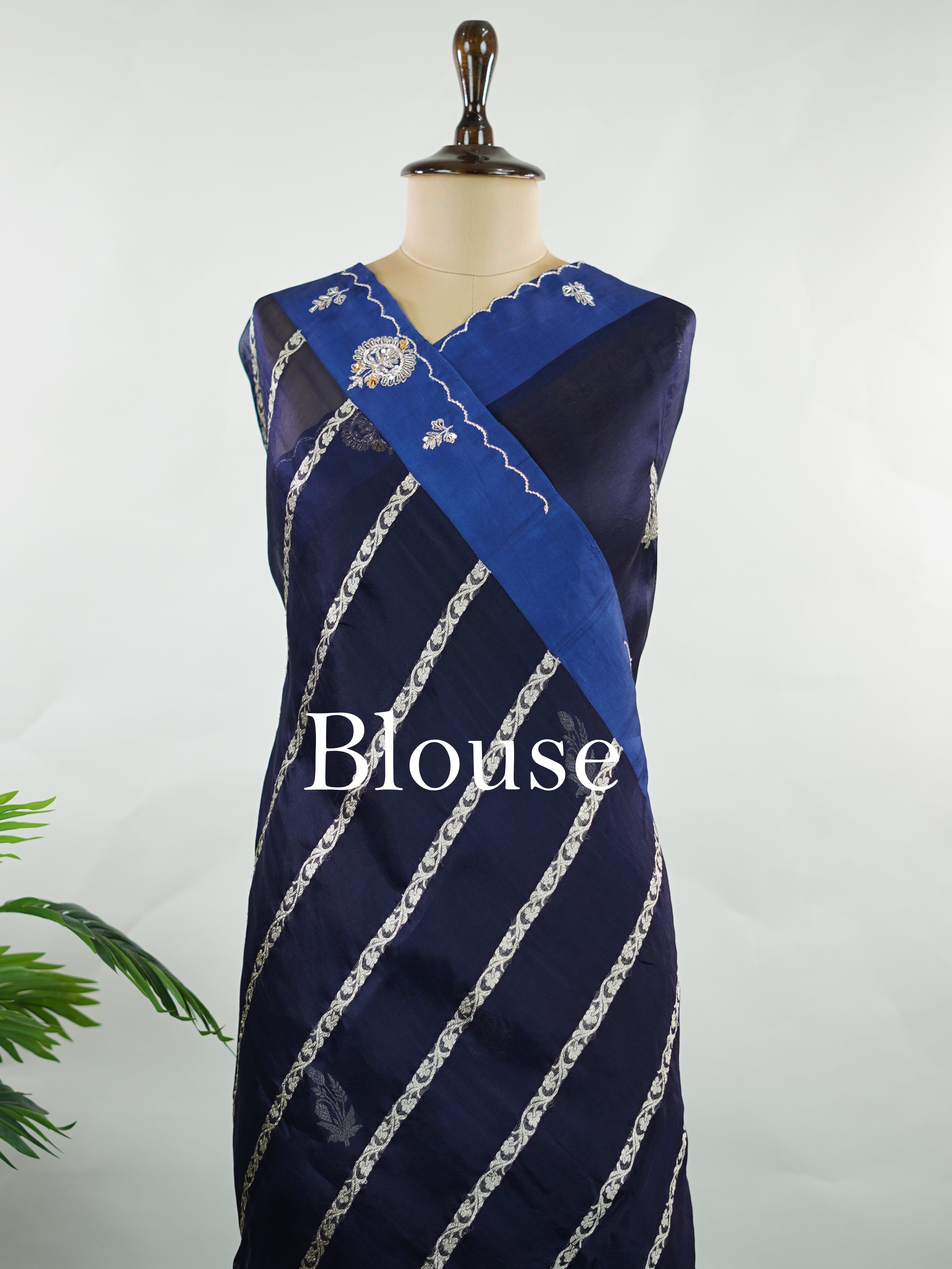 Organza Stunning dark blue organza saree adorned with elegant embroidery for a regal look.br data-start=82 data-end=85The sheer, lightweight fabric offers a graceful drape and effortless sophistication.br data-start=169 data-end=172Intricate embroidered work adds depth, texture, and timeless charm.br data-start=239 data-end=242Perfect for weddings, festive gatherings, and evening celebrations. Kiara - Organza Saree | Embroidered - Manoranjitham Weaves - Handloom Store