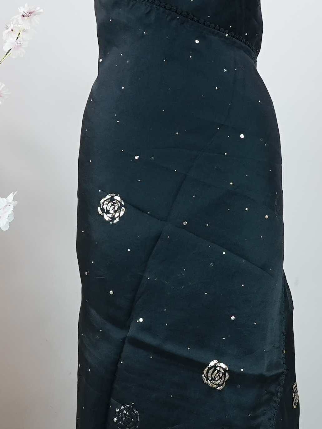 Organza Pure Organza saree in a rich Black hue, adorned with intricate Mukesh work and exquisite Badla detailing.br
A luminous blend of heritage craftsmanship and graceful elegance, perfect for festive and occasion wear. Ishanvi - Black Organza Saree | Mukesh Work - Manoranjitham Weaves - Handloom Store
