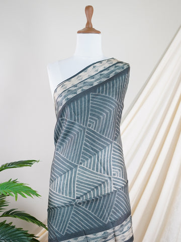 Tussar A Tussar saree with minute hand-done Shibori all over the body, featuring a contrast border and pallu with hand-drawn pen Kalamkari. Elegant, artistic, and truly unique. Sarvamangala - Manoranjitham Weaves - Handloom Store